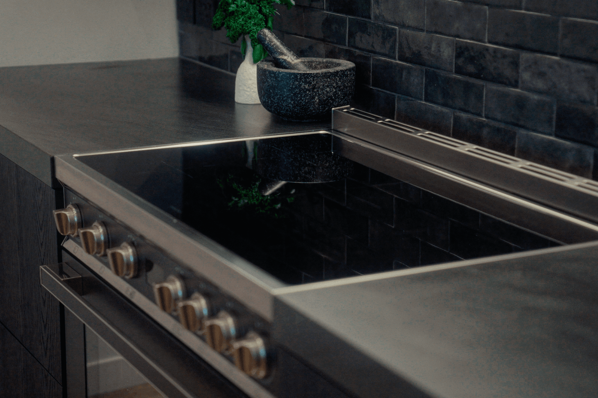 An induction cooktop offers faster boiling, better control and a cooler, more comfortable kitchen environment.