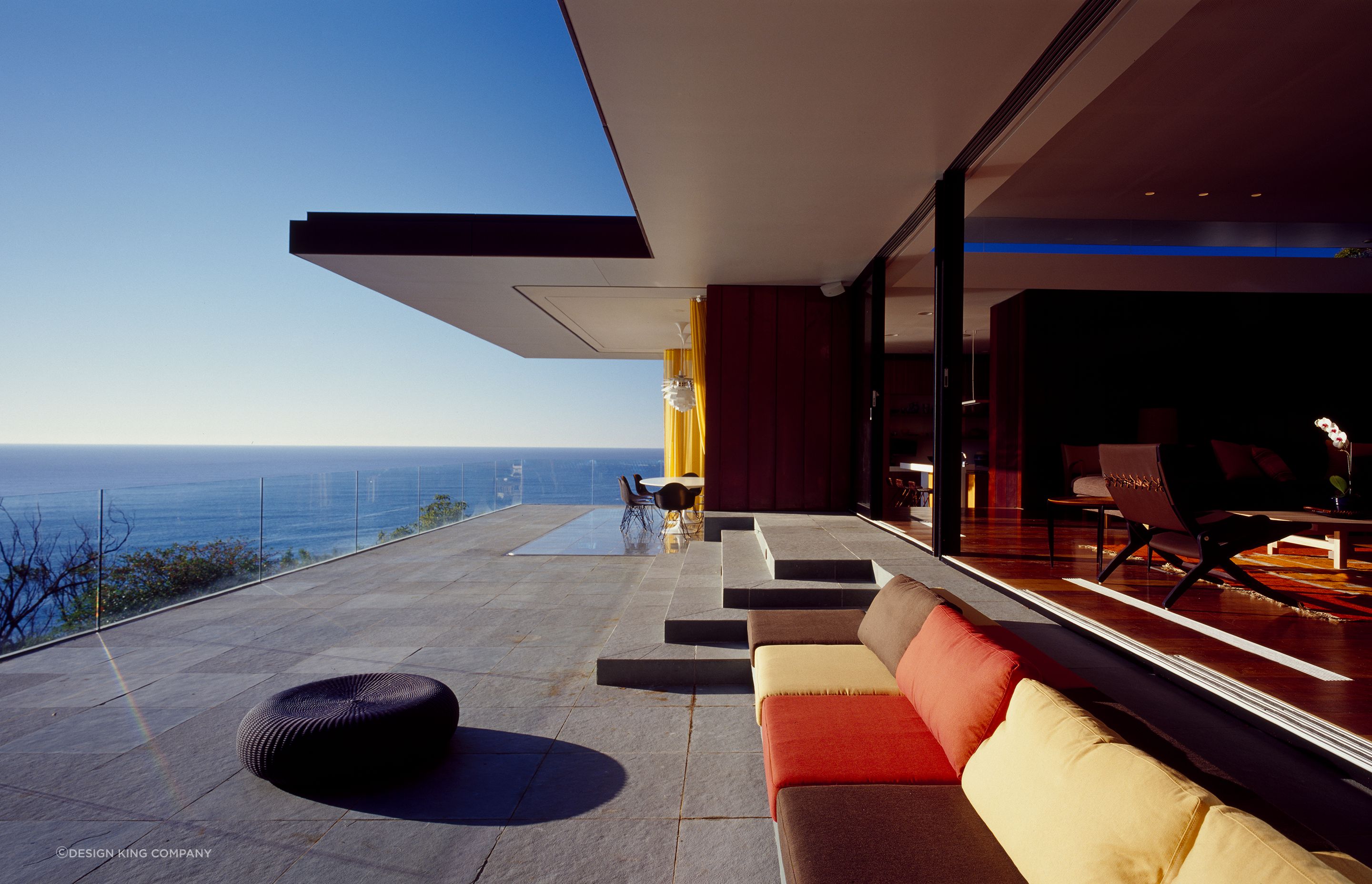 Glazed openings lead out to this incredible balcony offering panoramic 180-degree views. Photography: Brett Boardman.