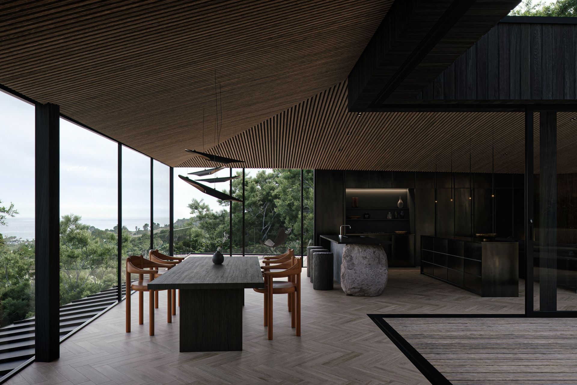 The floor-to-ceiling windows open the home up to the native bush surroundings and the Hauraki Gulf.