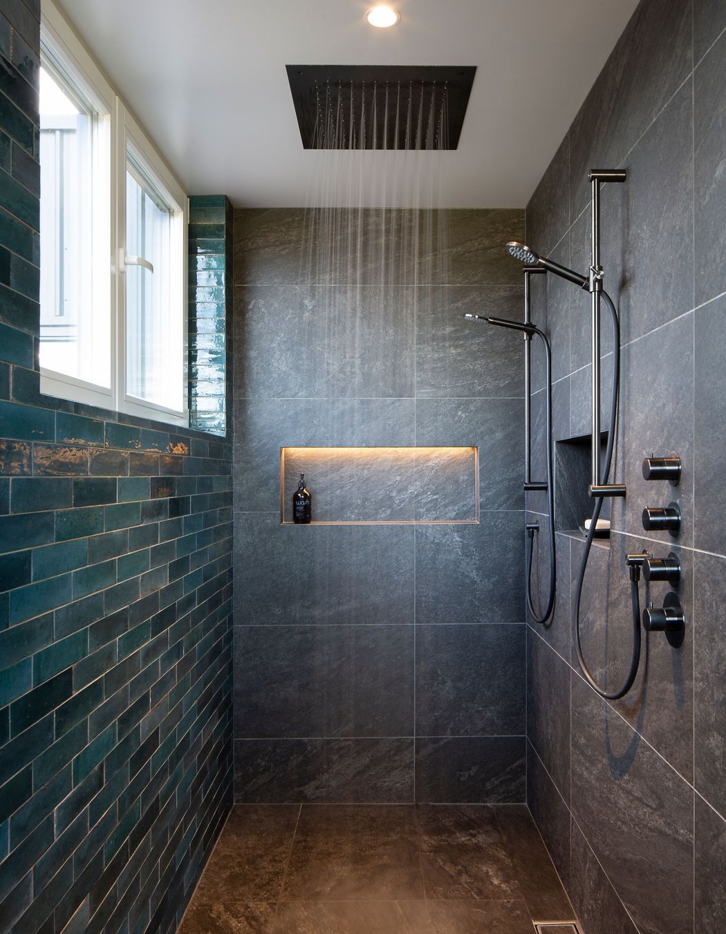 The master bedroom walk-in shower offers a sneak peak to the views through the windows.
