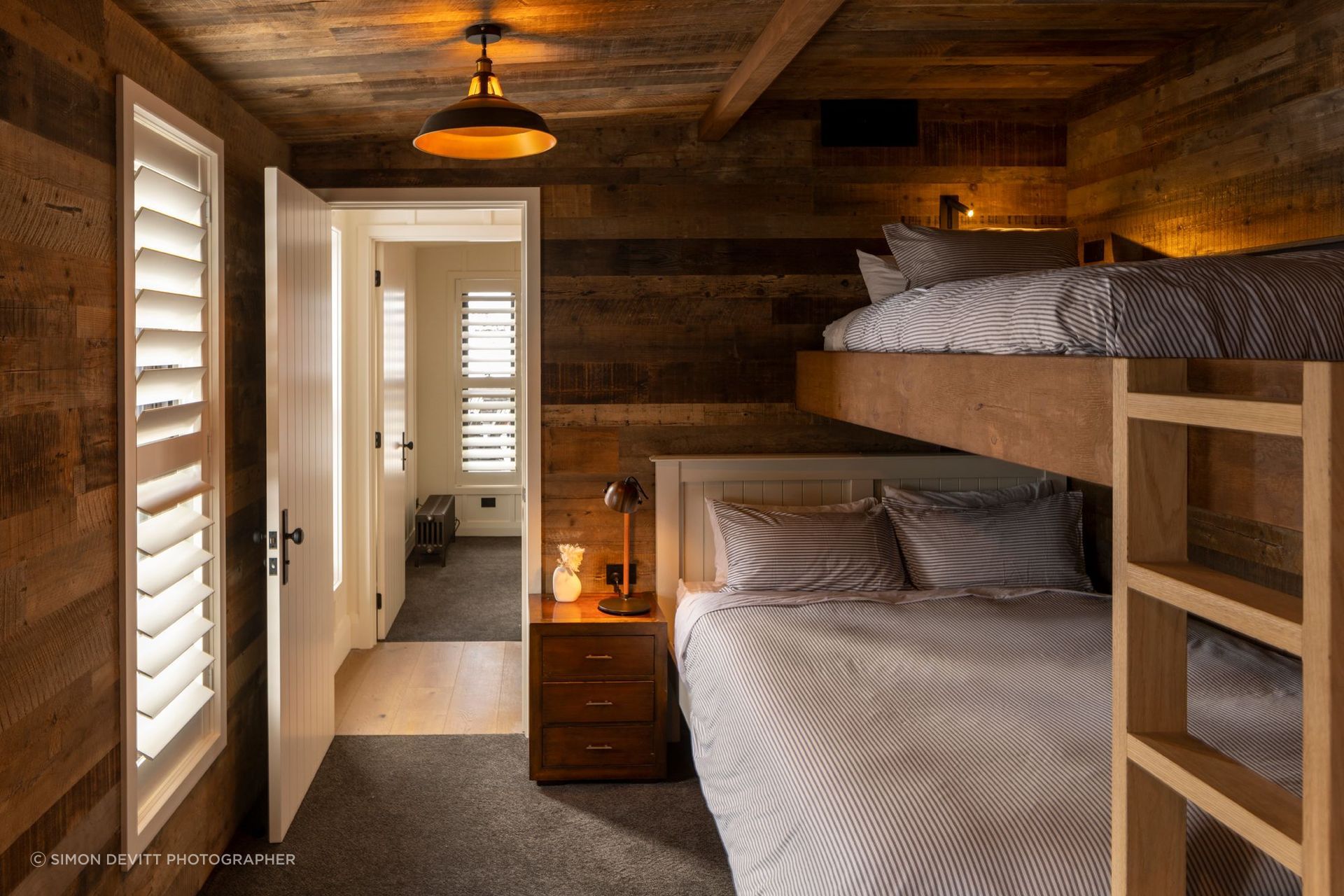 One of two bunk rooms. “The plan was that parents could have children close by but with the run of the bunk room to their heart's delight,” says Vee.