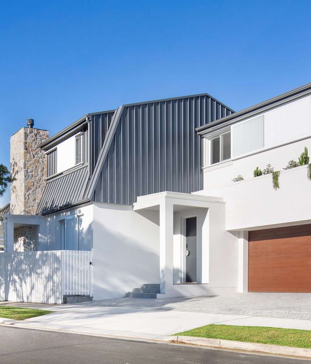 Barn House celebrates grounded, intentional architecture with natural stone material palette