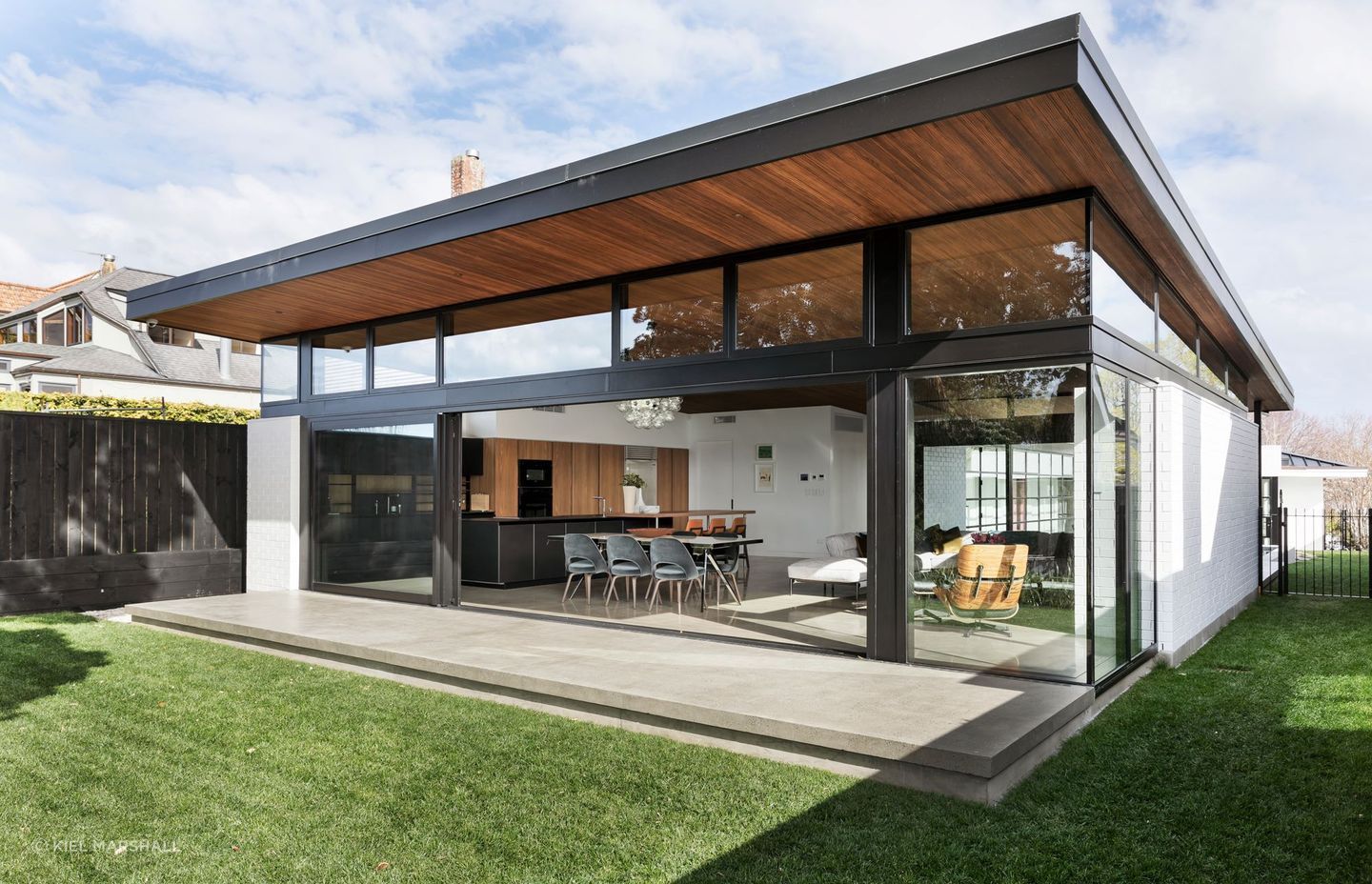 A sophisticated blend of history and luxury personifies this Remuera House featuring stepped brickwork.