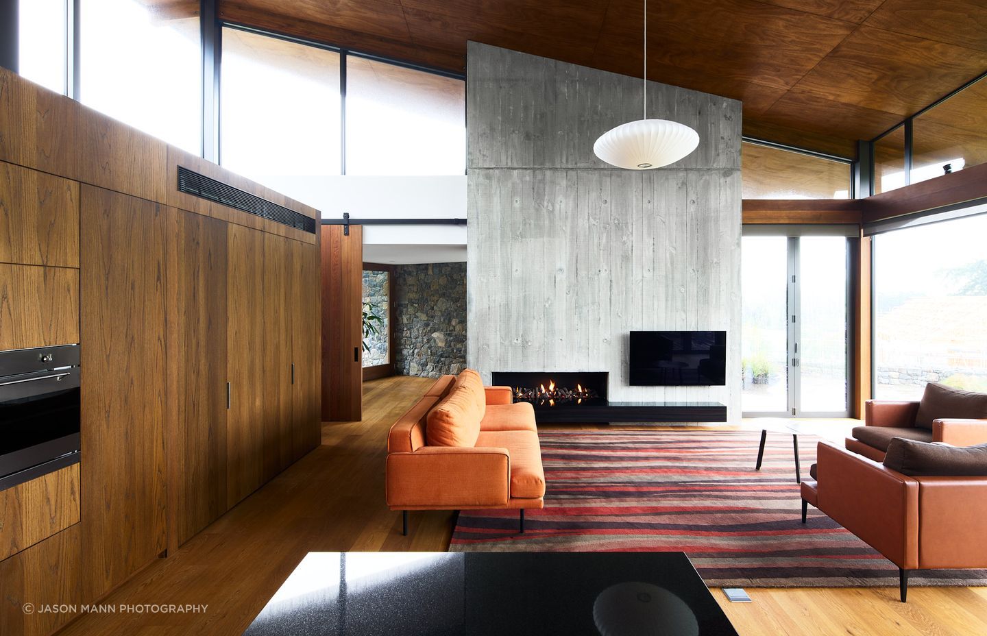 Like a concertina, the ceiling height shifts as the functionality of each space changes. "We tried to get this experience of every space having its own particular character, volume, light, quality of material, and make it a sequence as you move through,” Jasper explains.