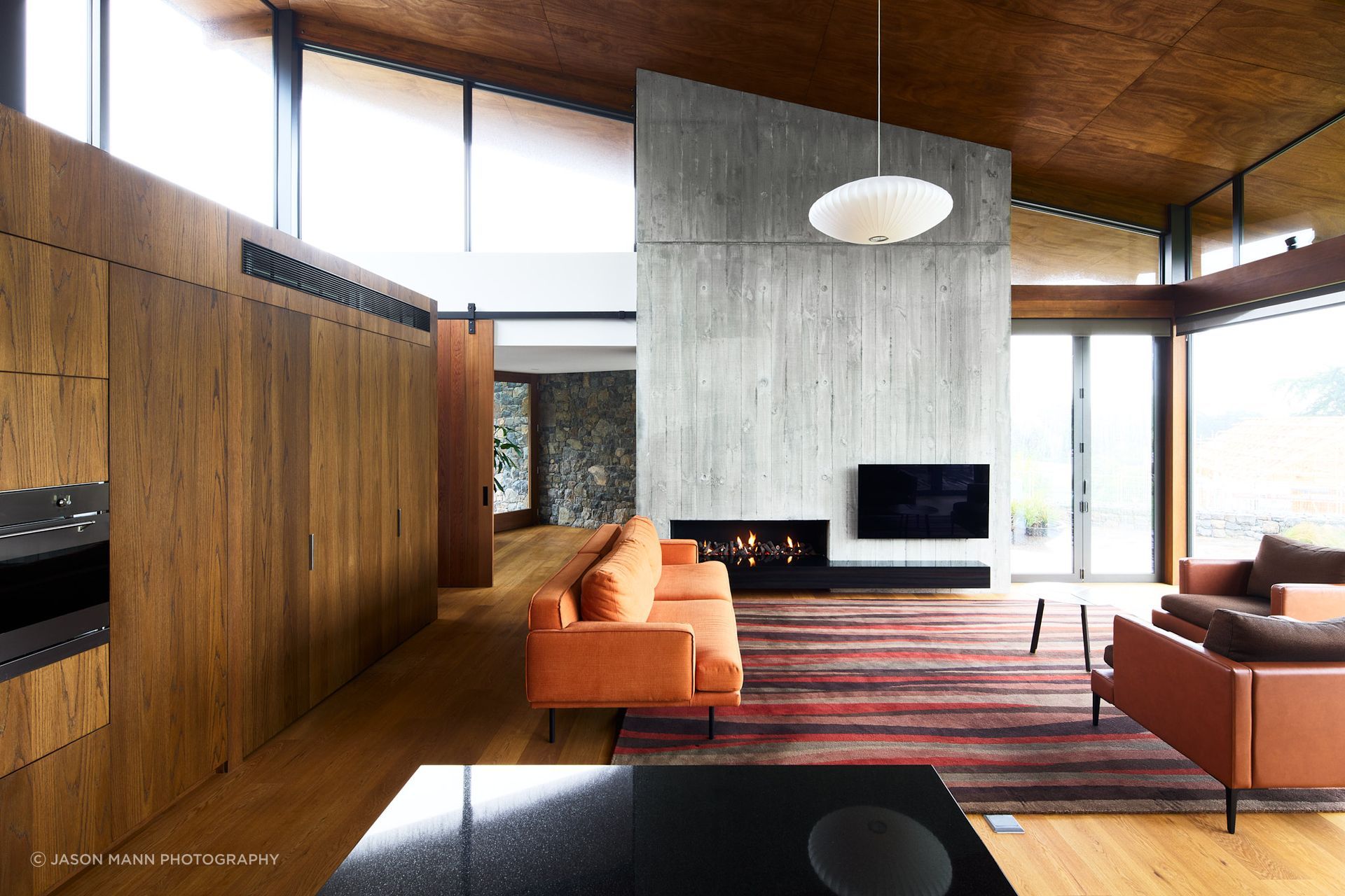 Like a concertina, the ceiling height shifts as the functionality of each space changes. "We tried to get this experience of every space having its own particular character, volume, light, quality of material, and make it a sequence as you move through,” Jasper explains.