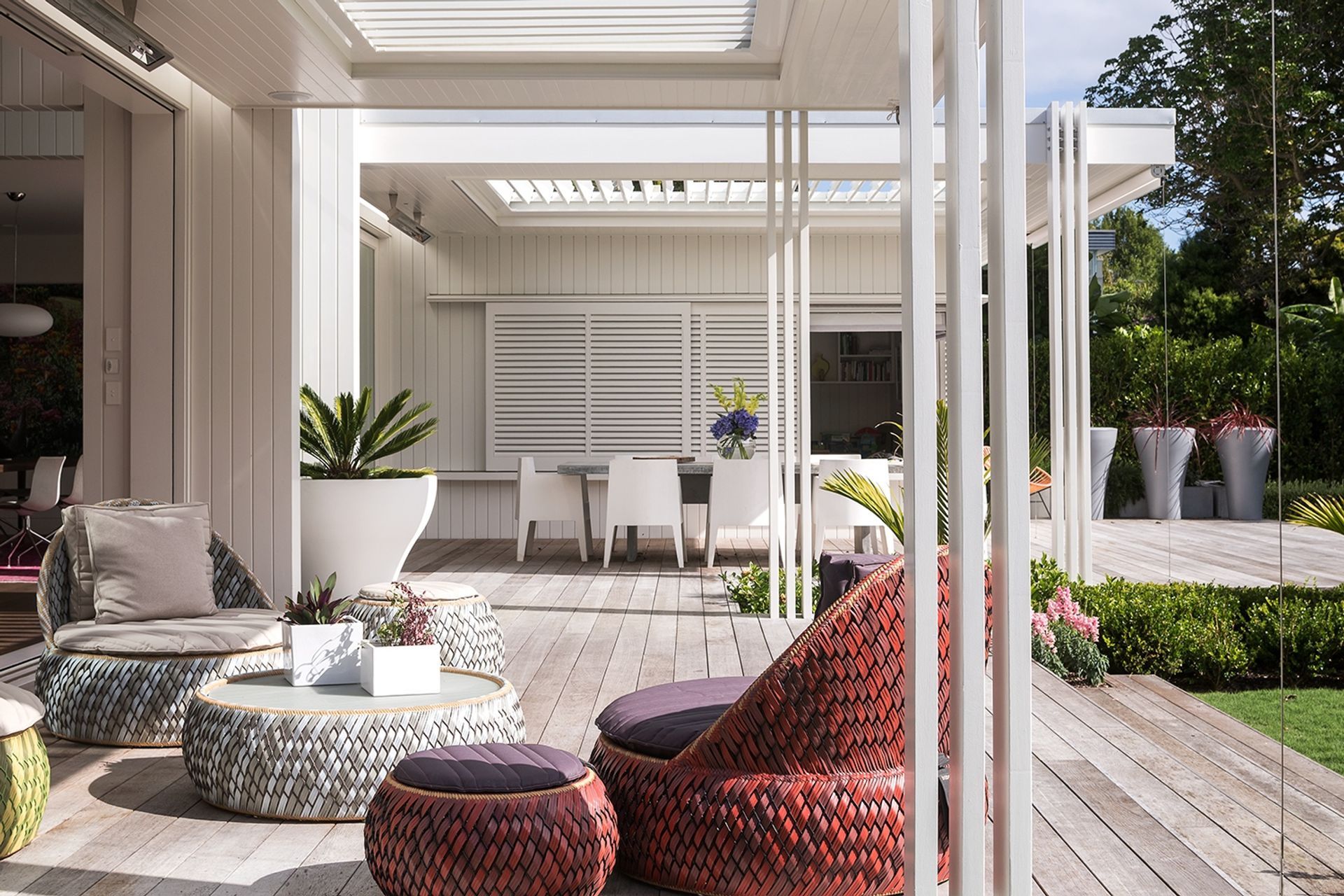 The rear addition seamlessly flows into a comfortable outdoor living space.