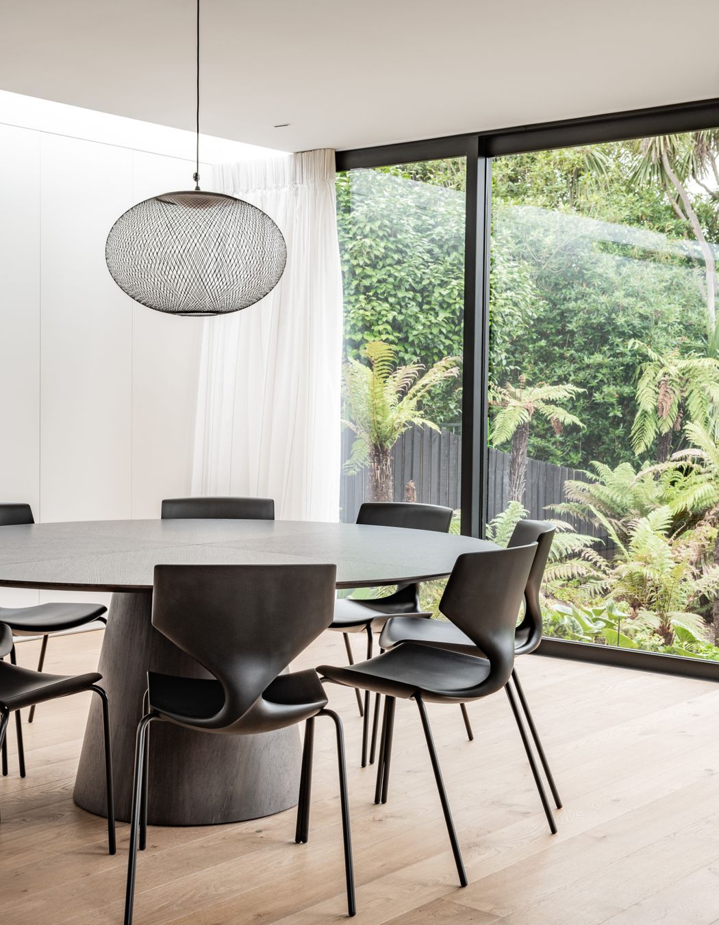 The dining area connects to the outdoors with a view to the stream at the bottom of the garden. “The key motivator is all about filling the house with light, because it hasn't got that direct northern orientation.”