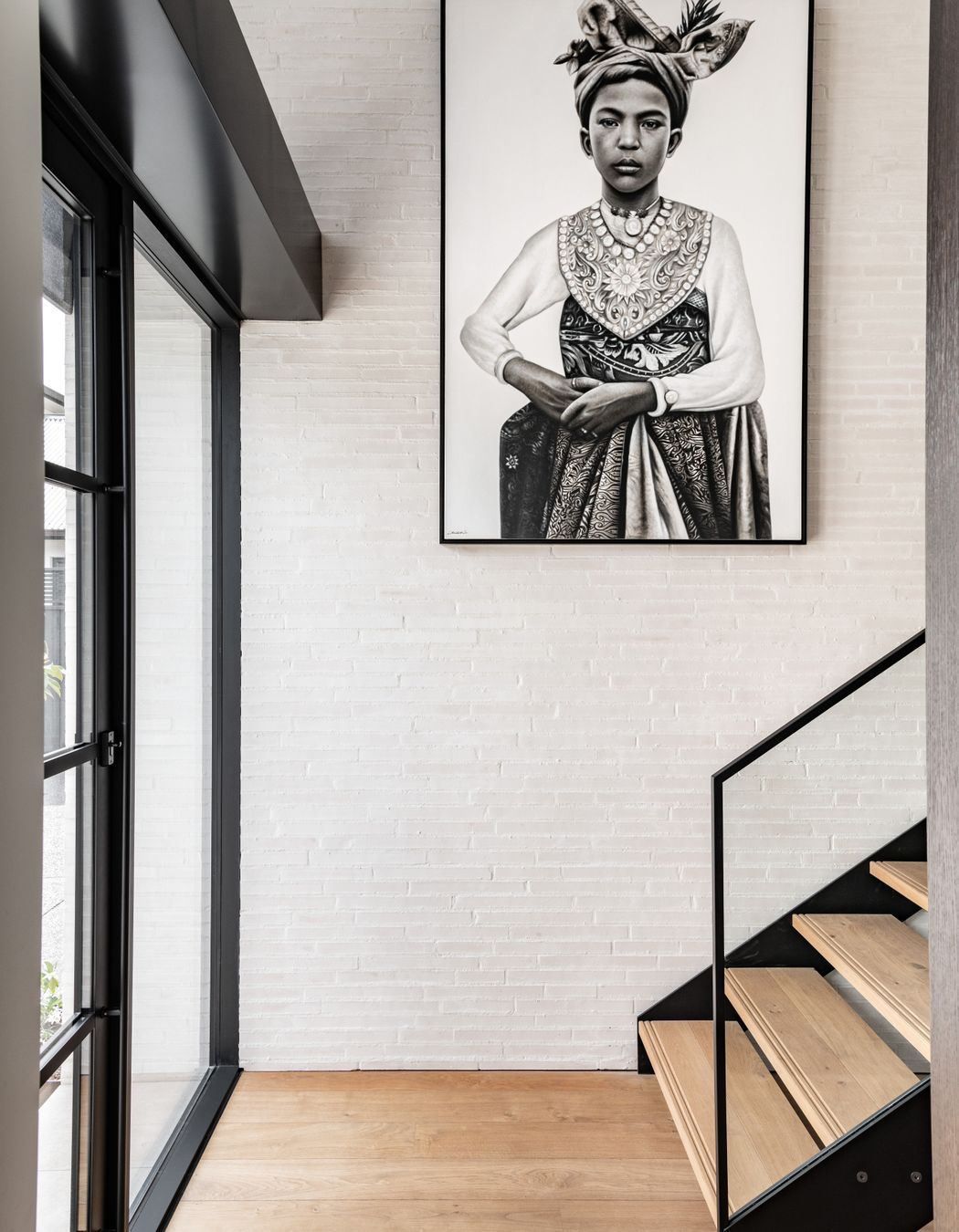 In the entrance, the warmth and texture of the custom made Canterbury Clay Bricks is carried through from the exterior. Tobin says he specified quite a thin profile at the request of the client.