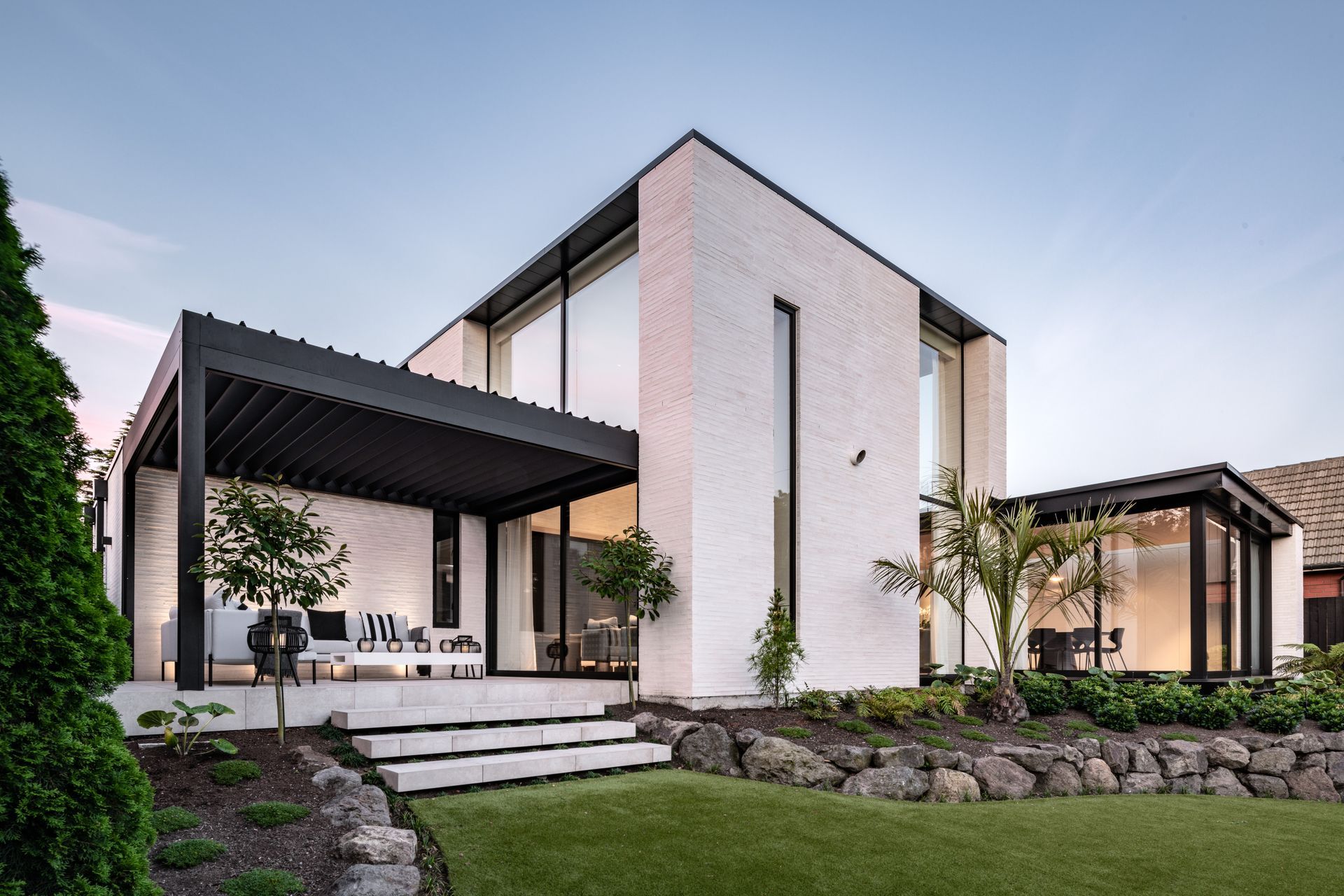 Tobin says the vertical proportions with deep-set windows is part of the Mediterranean-inspired style.