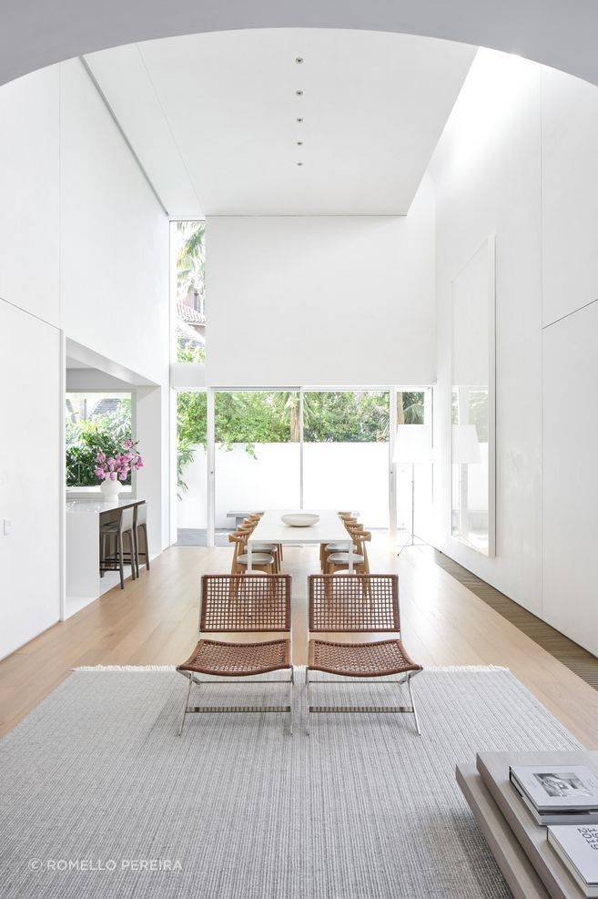 The new kitchen is tucked to the side of the double-height volume open-plan living space.