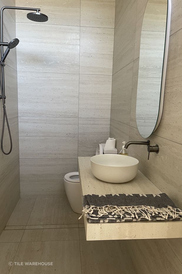Sensi Roma Ivory Matt in a 596x1194mm profile has also been used for the bathroom vanity.