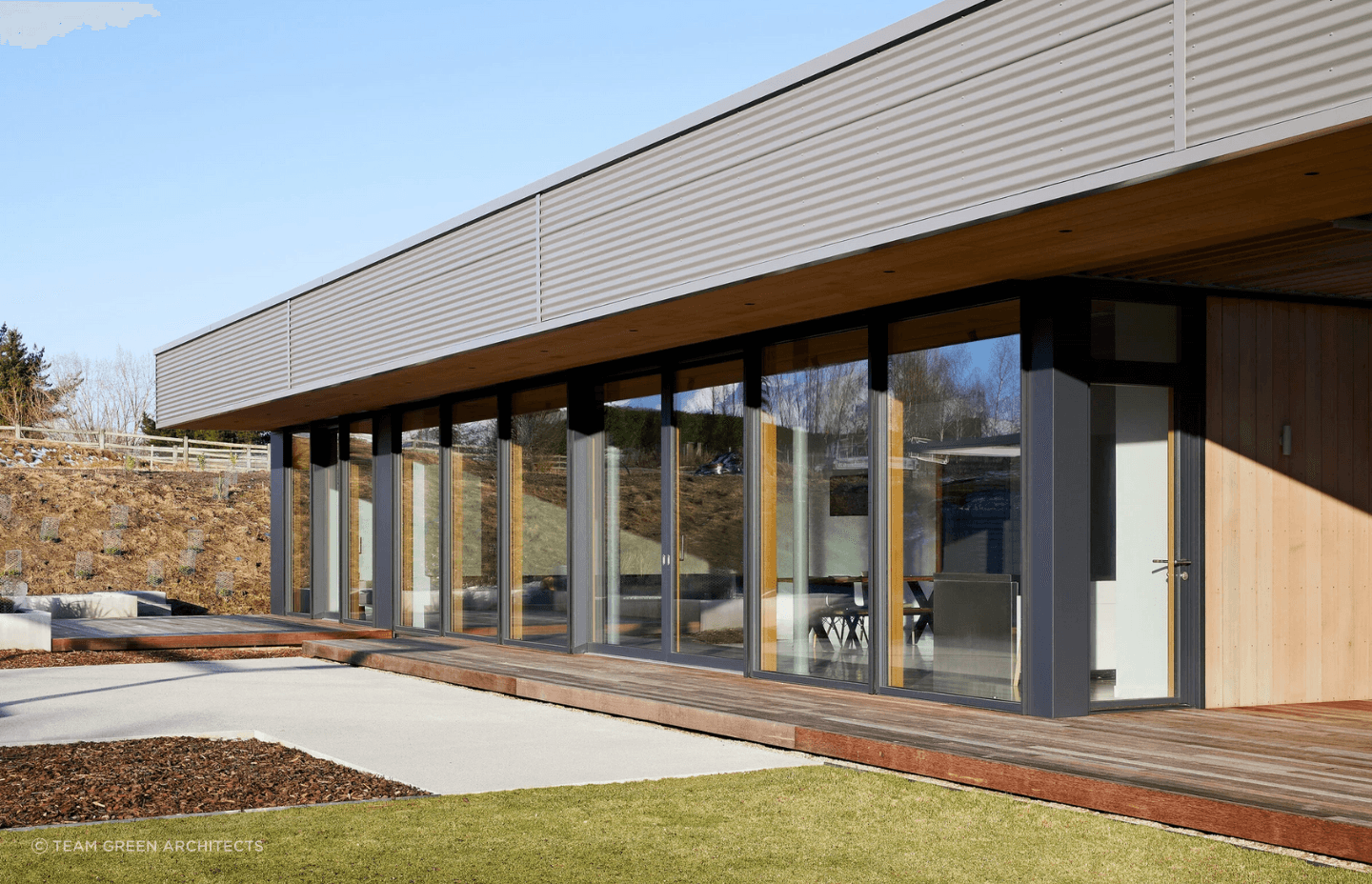 Light pours in from a wall of glass to the north.