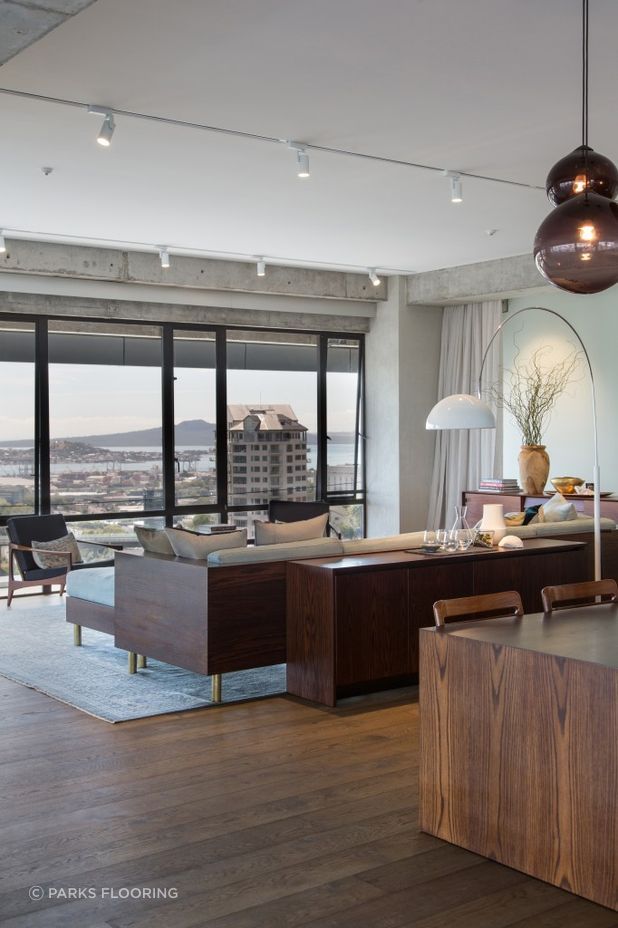 Paired with simple white walls and a combination of industrial and sleek, modern finishes, the rich maple and chestnut hues of the Natural and Smokey-coloured Oak are a tasteful addition to the material palette.