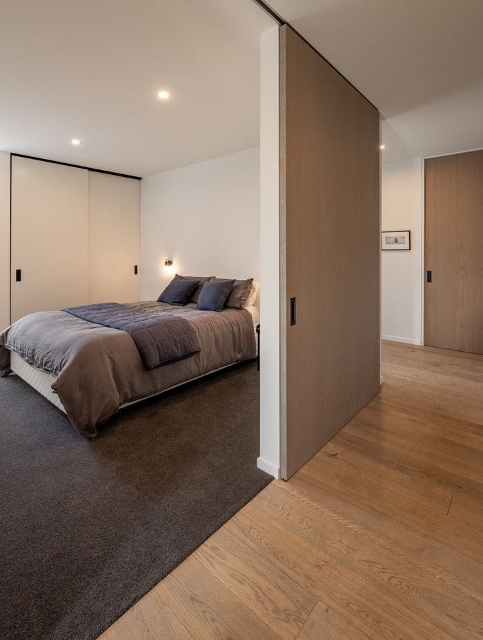 All doors and sliders are full height, to create a feeling of scale as well as to improve cross-ventilation. The house is very thermally efficient and also has a ducted heat pump system.