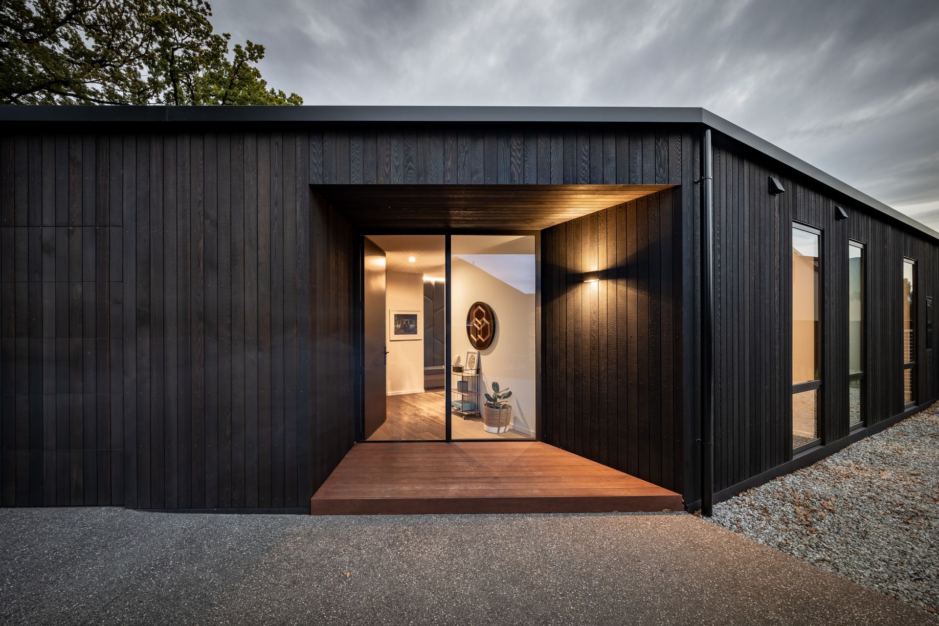 “I tend to play a bit with scale. Those entry doors are 2.7 metres tall so although it looks small and compact, when you get there it's quite a big dwelling.” The cedar cladding is by Rosenfeld Kidson.