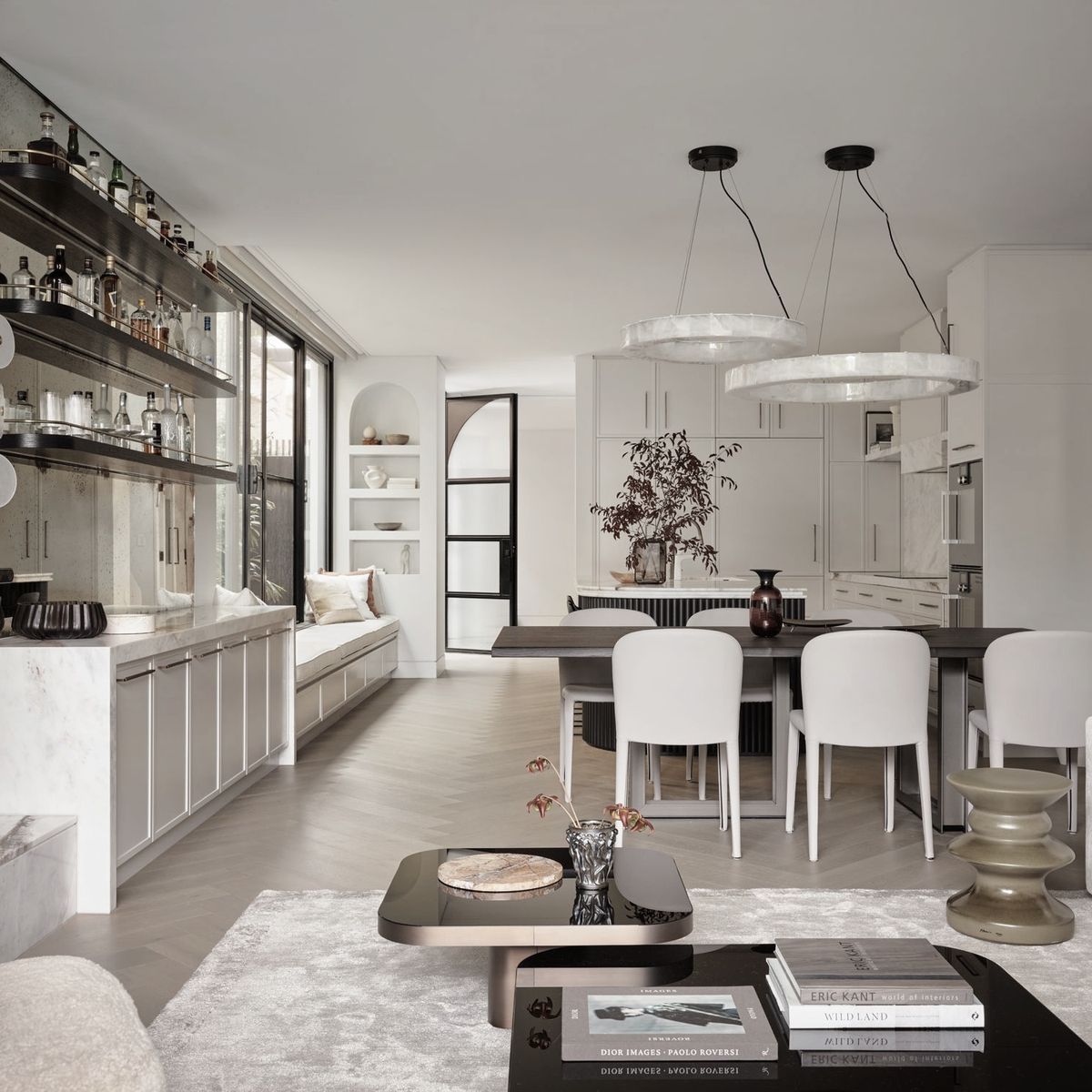 Spatial acrobatics and masterful composition transform this standard duplex into two extraordinary homes