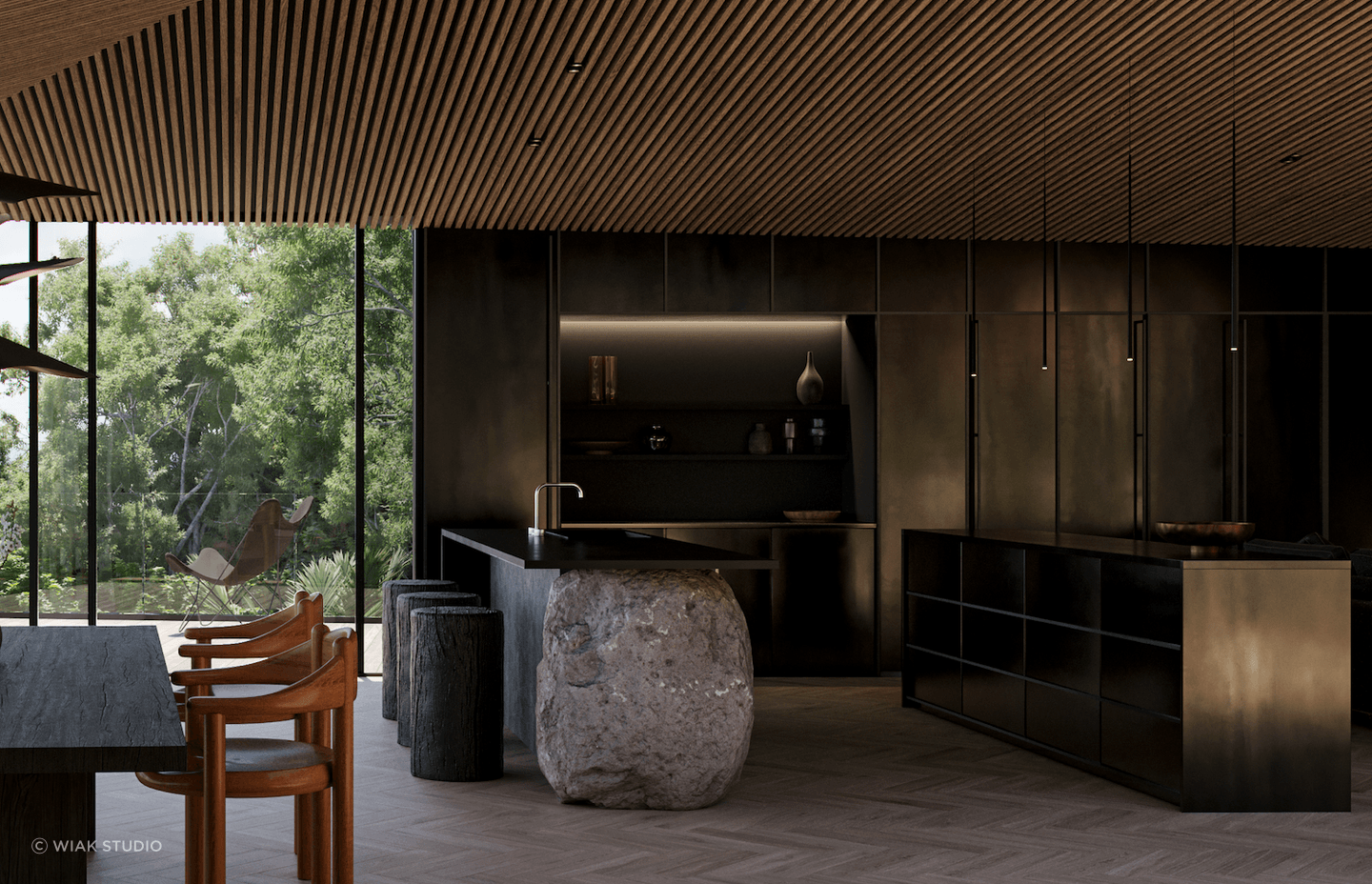 The sleek black kitchen was designed to contrast against the nearby greenery.