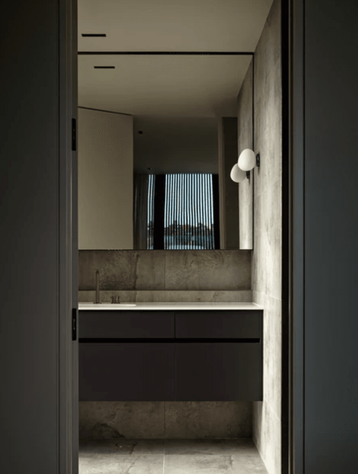 “We oriented the vanities in the ensuites so that the mirrors reflected the view behind,” says Evelyn. The lighting is from ECC.