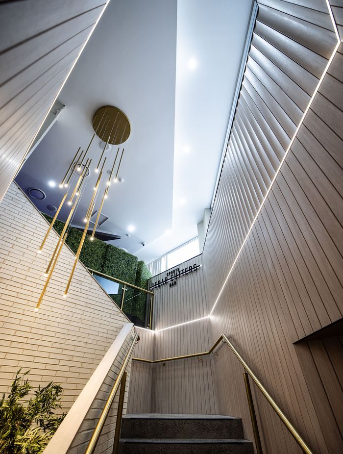 Screenwood PANELS rangge in Flute line the stairwell.