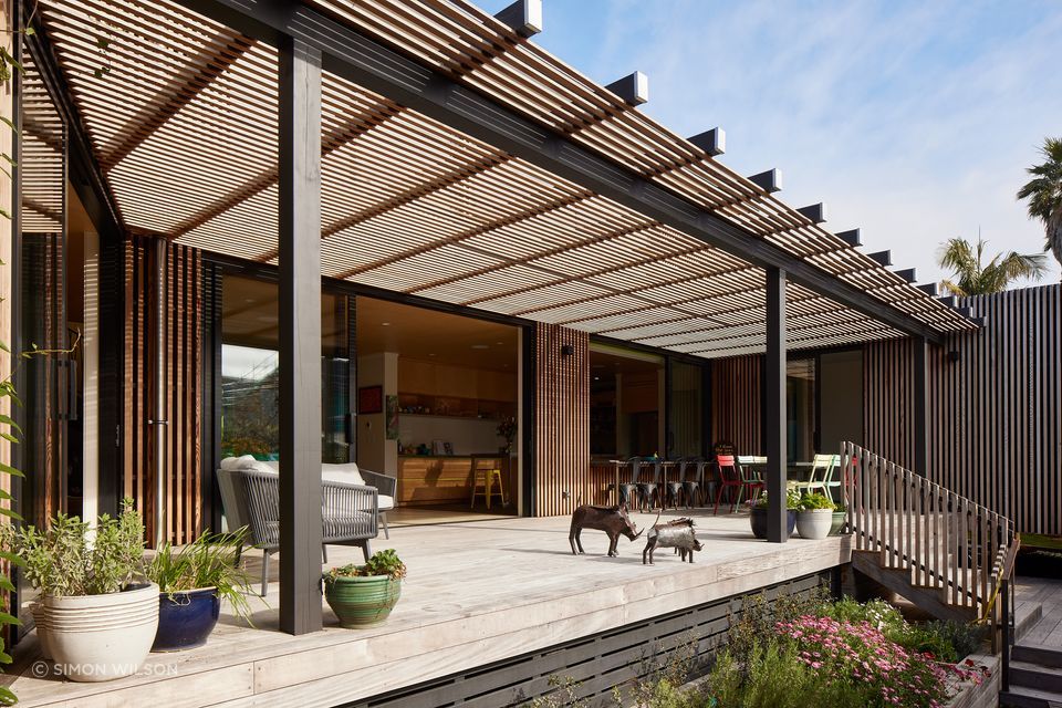 The sheltered courtyard provides ample space for the client, Pip, to spend time with her family.