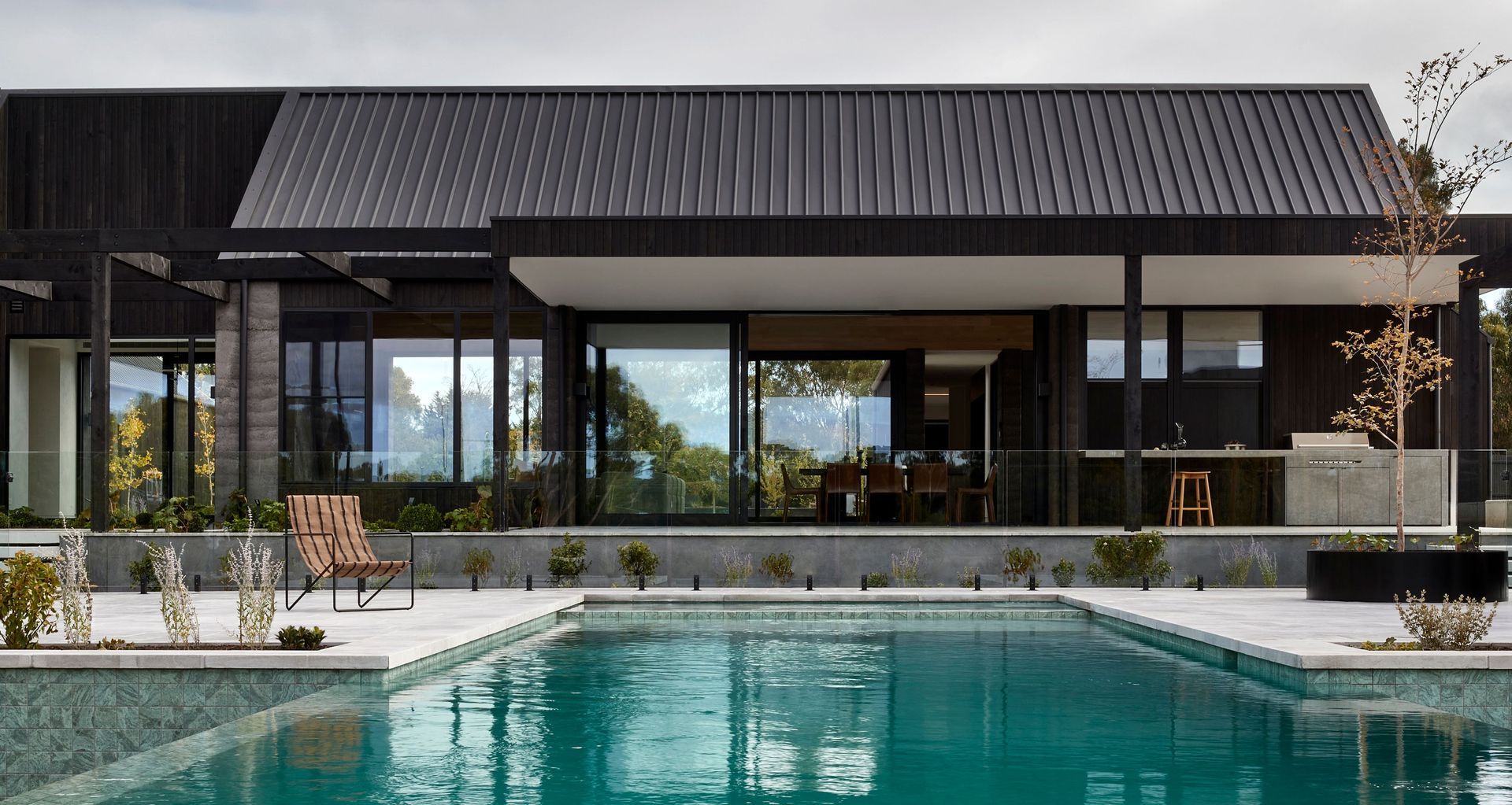 Throughout the home, oversized glazing elements from Architectural Window Systems were used to maximise openness and frame moments of landscape and connection between spaces. Image credit: Shannon McGrath @shannonmcgrath7