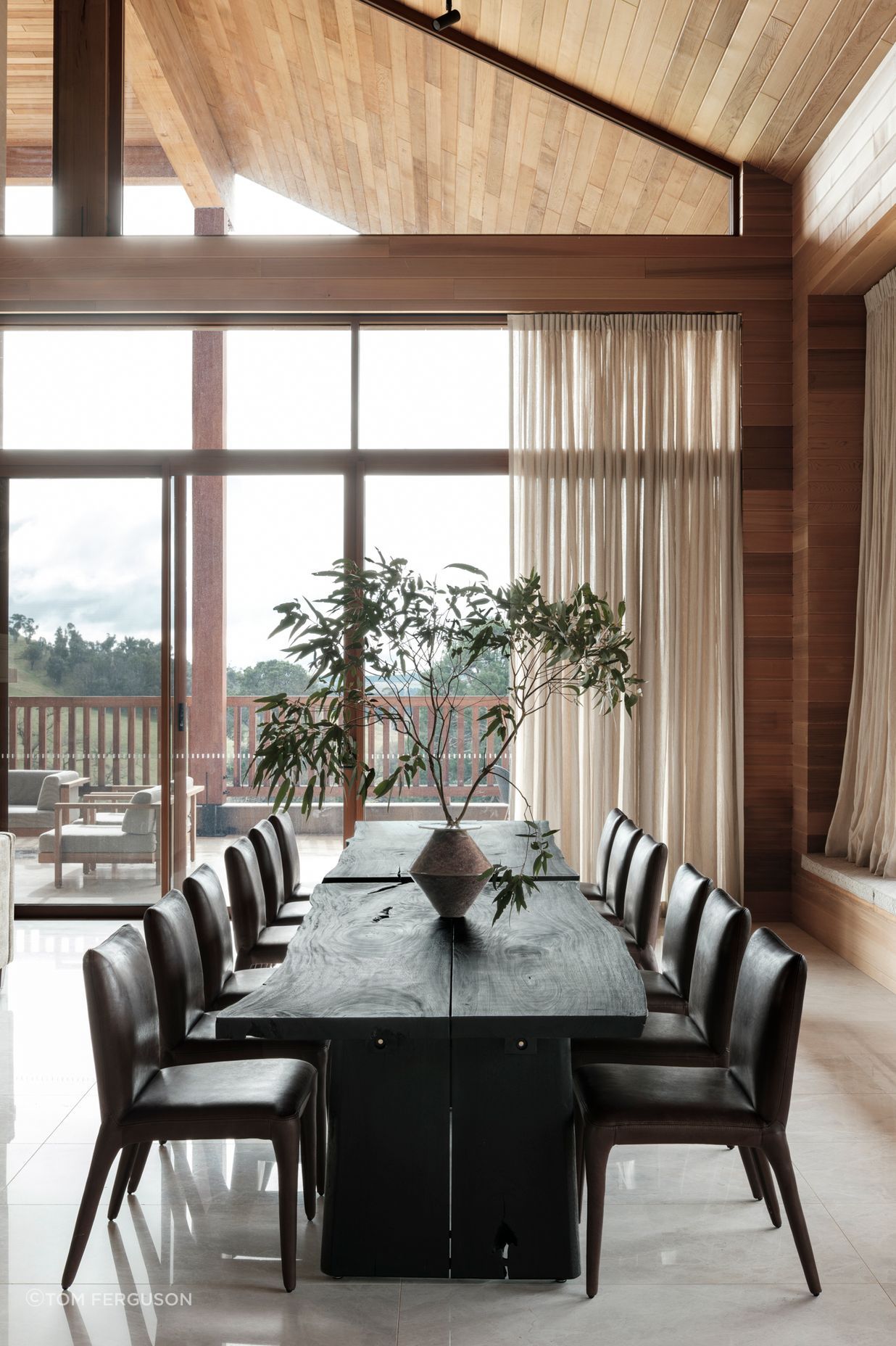 Across two dining tables, up to 14 people can gather for meals.