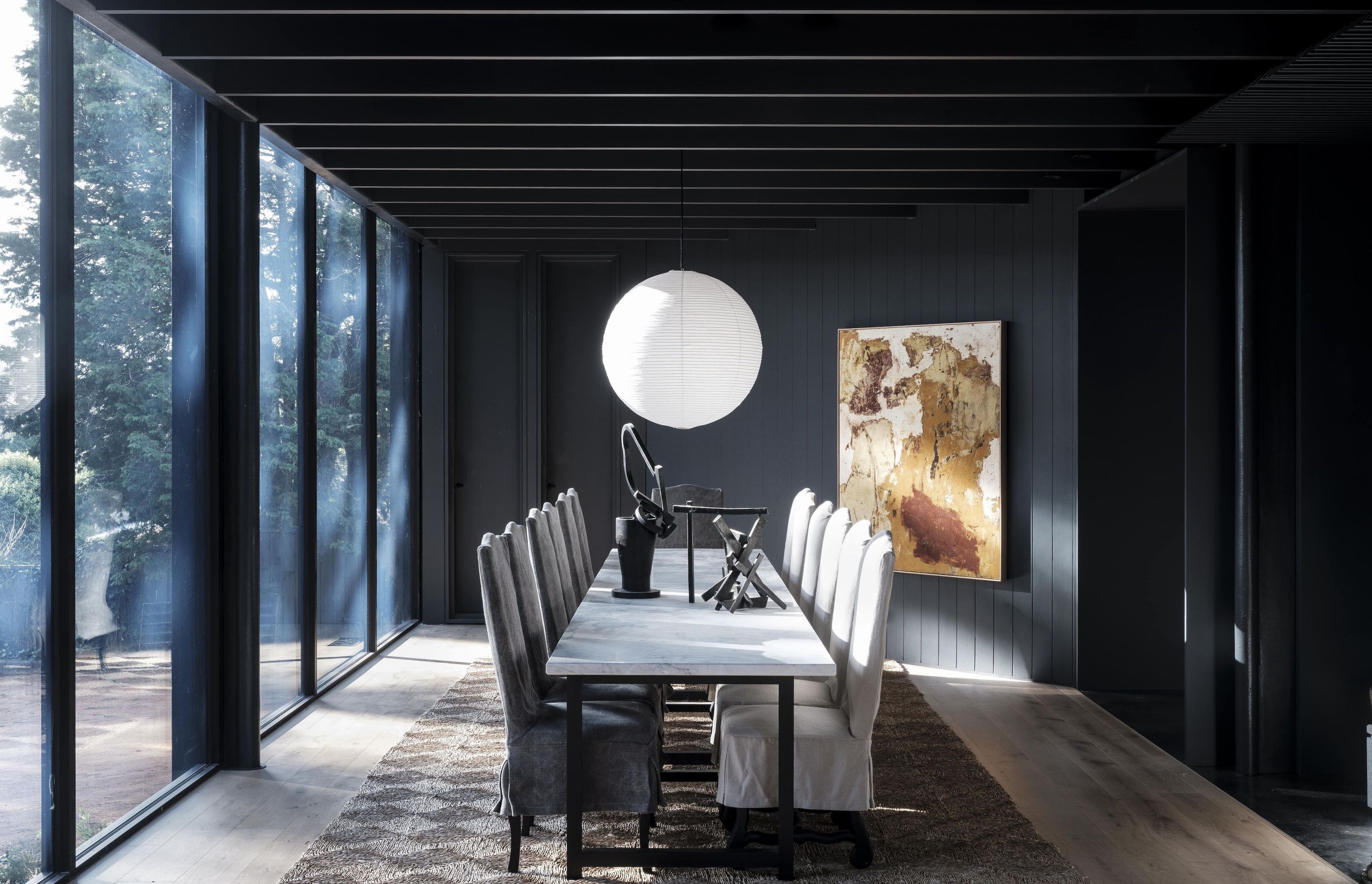 The dining room's restrained palette allows the artwork to do the talking.
