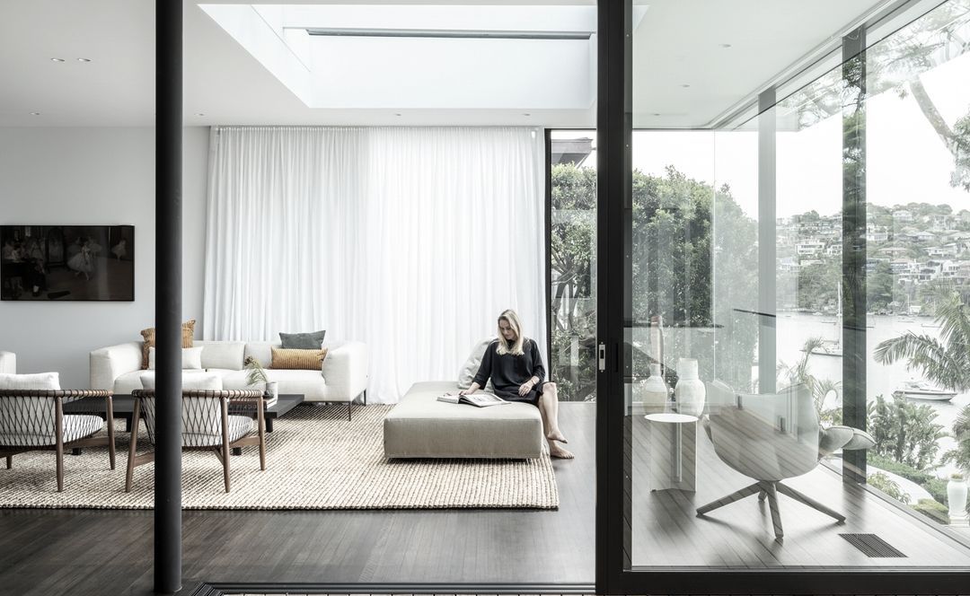 A serene and sophisticated abode cascading down to the water