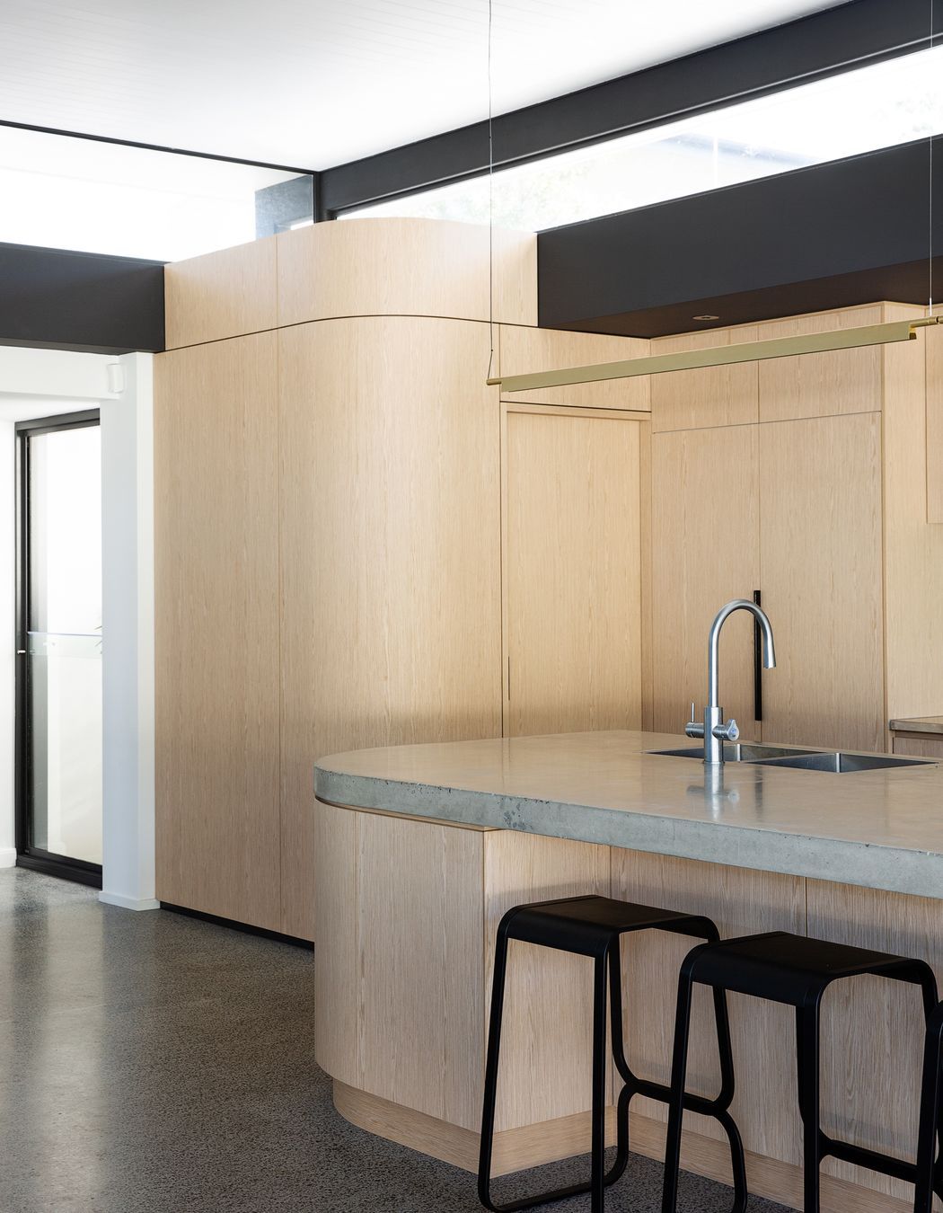 Clontarf Residence, Queensland: This residential project features Navlam Italian Oak, a pre-finished reconstructed timber veneer that achieves a warm oak tone throughout, inviting everyone into the space.