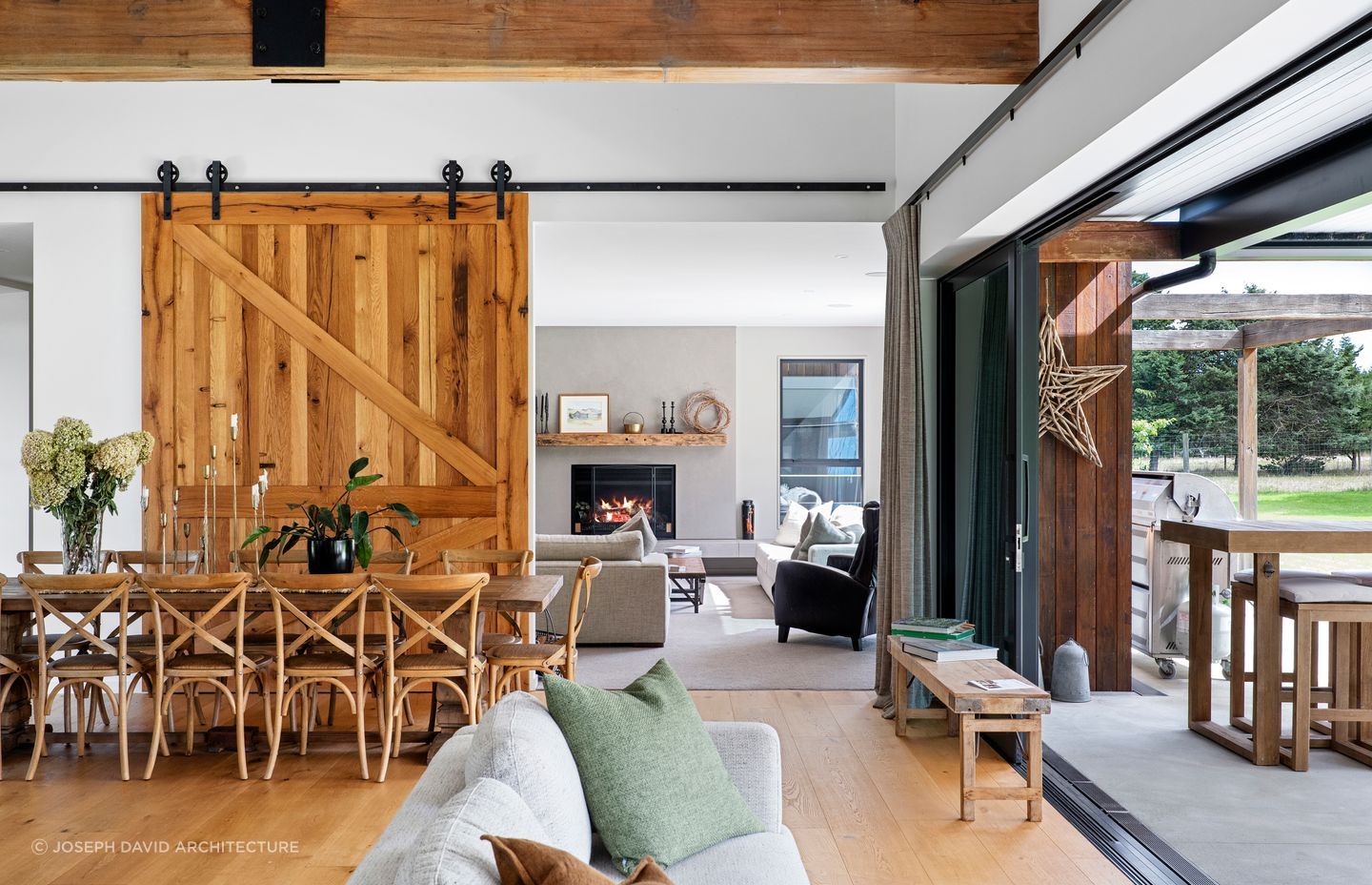 The timber barn door can be closed to enjoy the warmth of the fireplace in the lounge room.