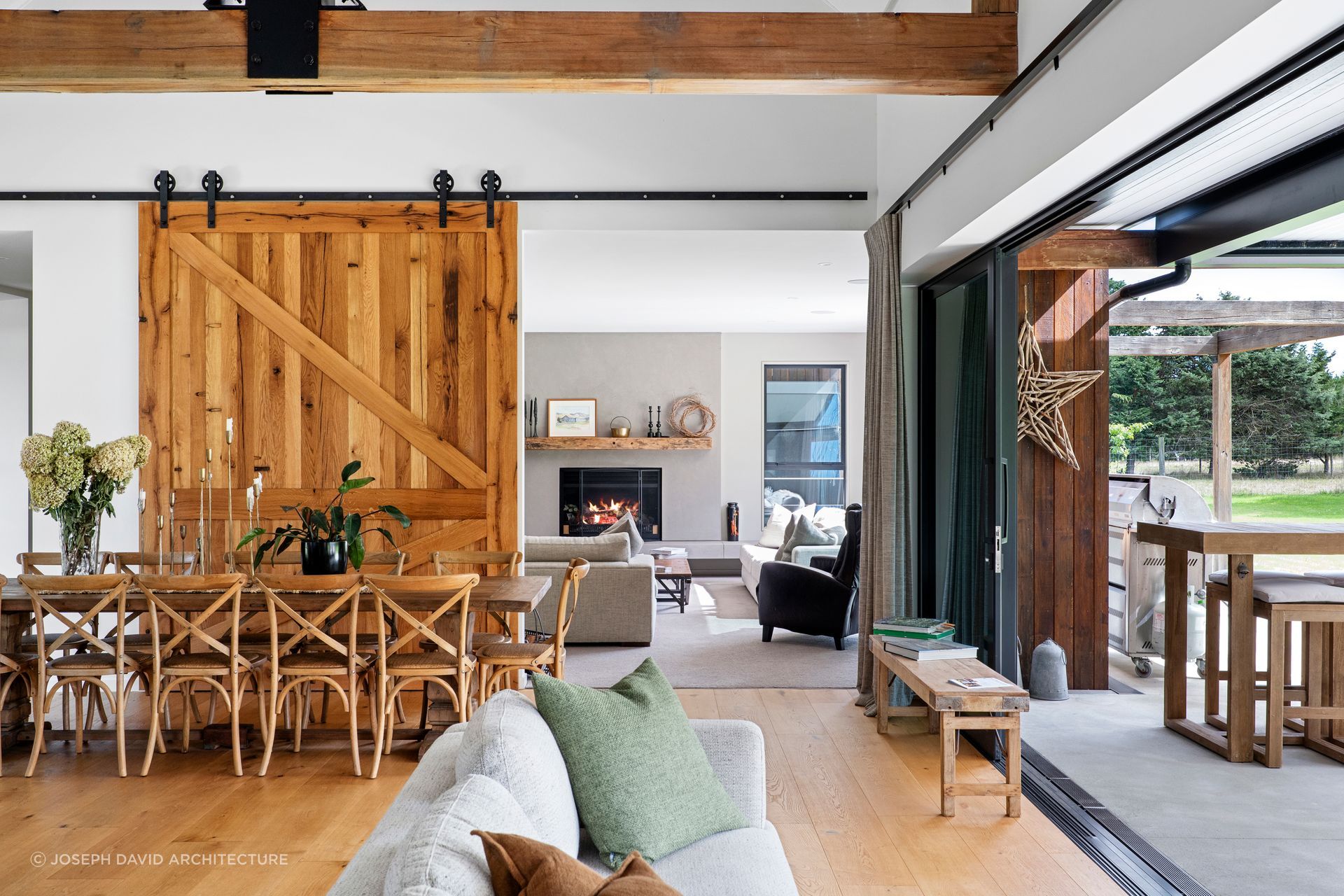 The timber barn door can be closed to enjoy the warmth of the fireplace in the lounge room.