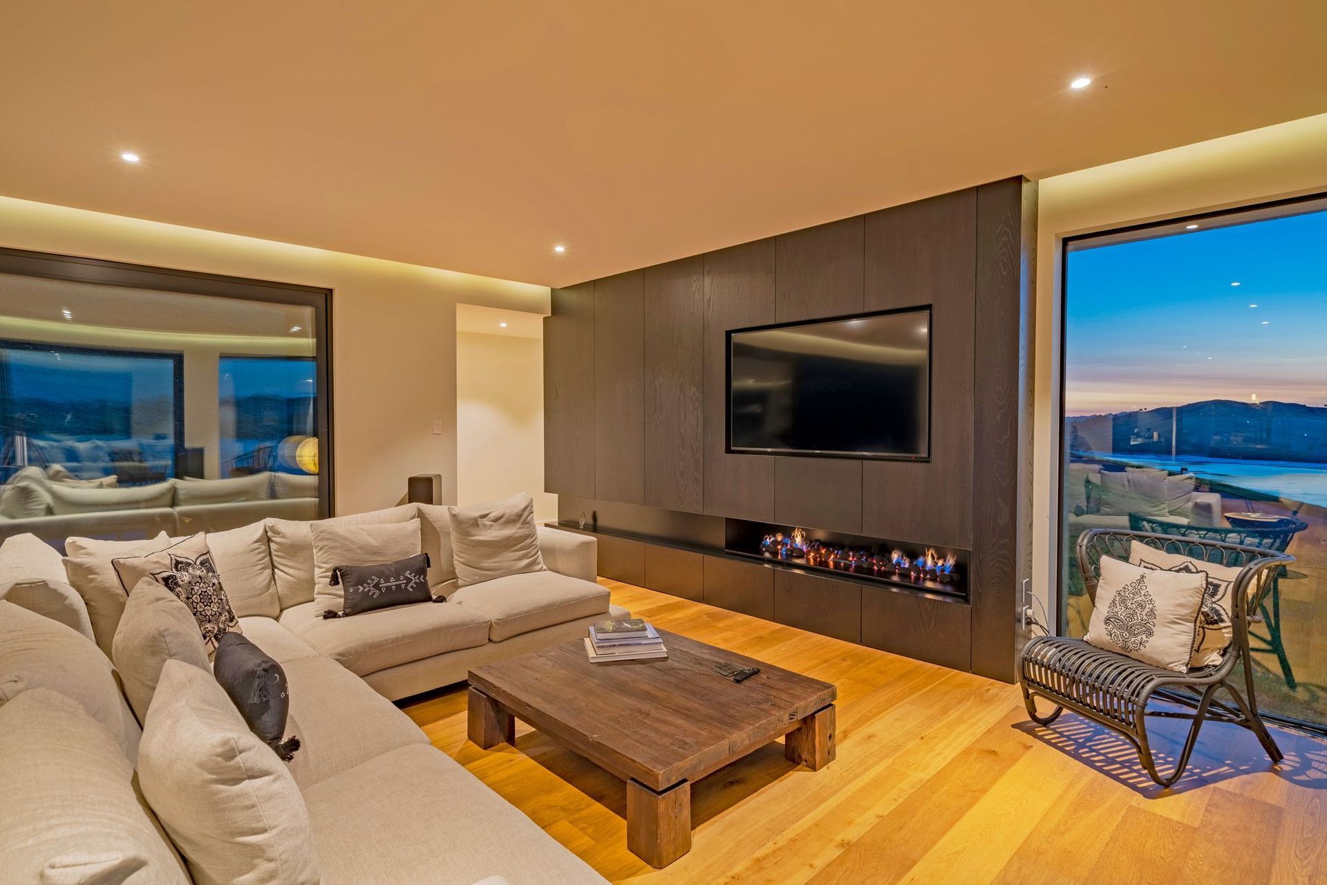 Bestwood Sienna Timber Veneer (Jaguar) panels mimic the kitchen cabinetry and give emphasis to the stunning Real Flame Simplicity Gas Fire.