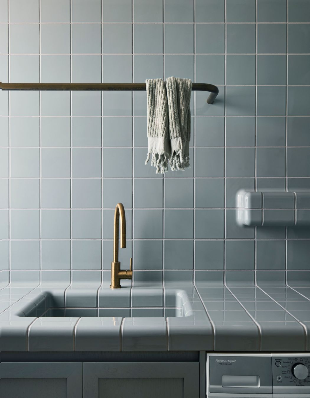 Muted tones in the traditionally tiled laundry.