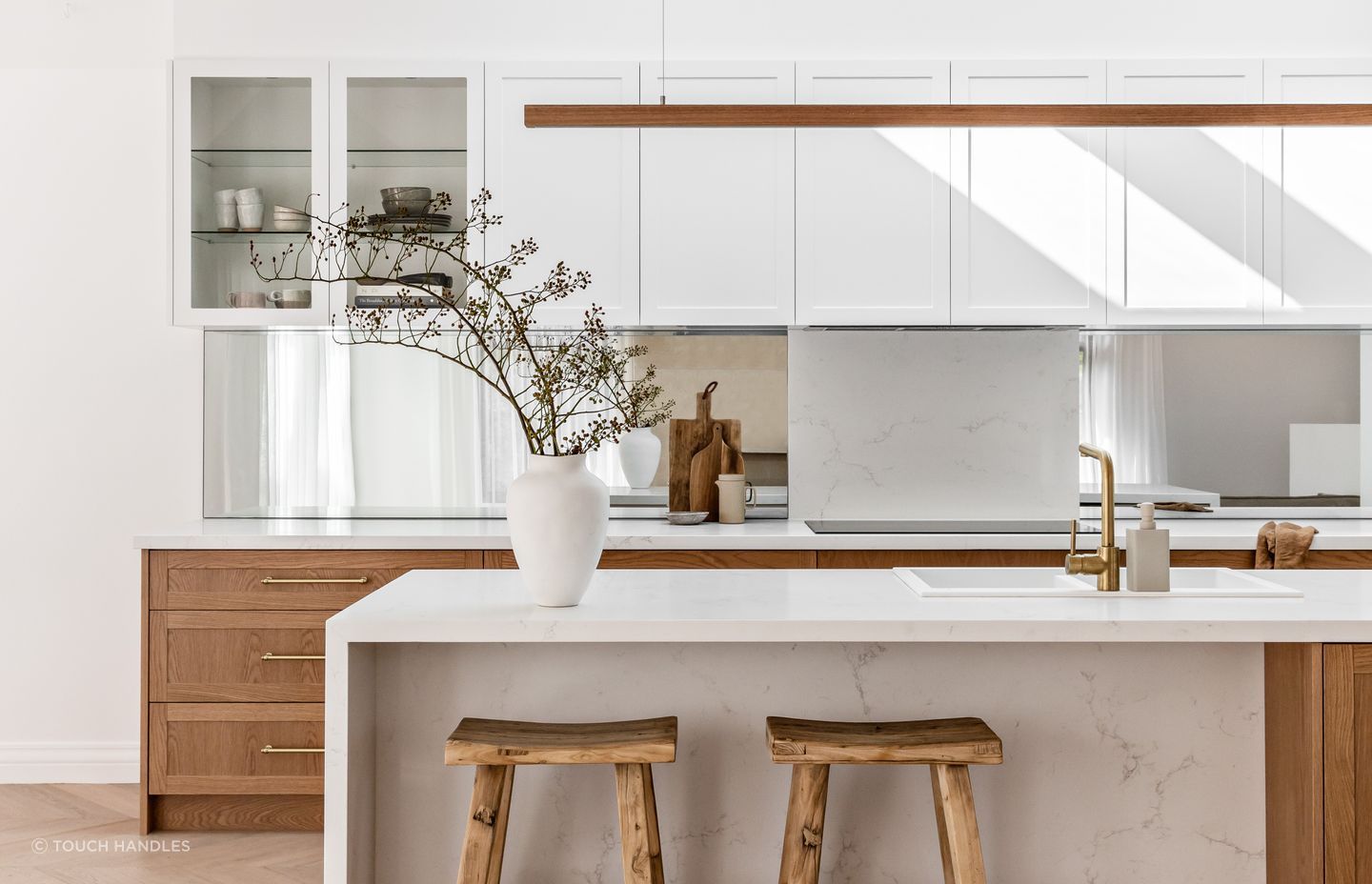 Sticking to one core colour with complementary accents is sometimes all that's needed as the stylish Spanish Mission Coogee Home kitchen shows - Photography: The Palm Co.
