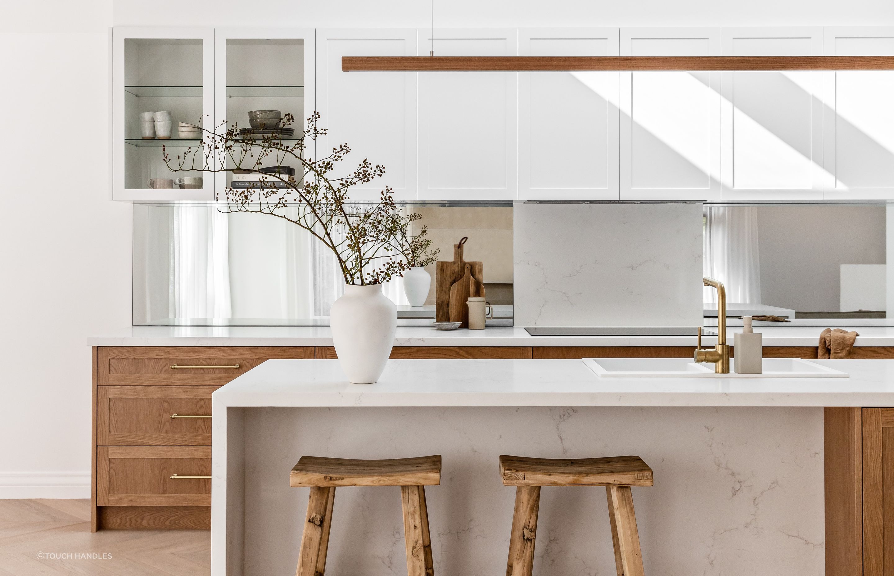 Sticking to one core colour with complementary accents is sometimes all that's needed as the stylish Spanish Mission Coogee Home kitchen shows - Photography: The Palm Co.