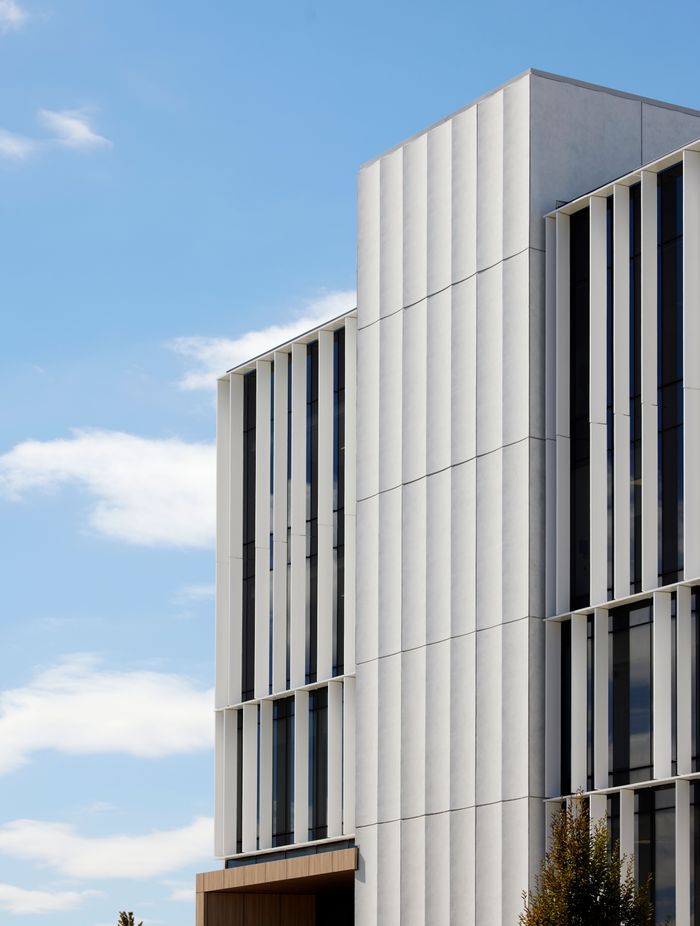 The exterior louvres are functional, carefully allowing natural light into the building's office spaces.