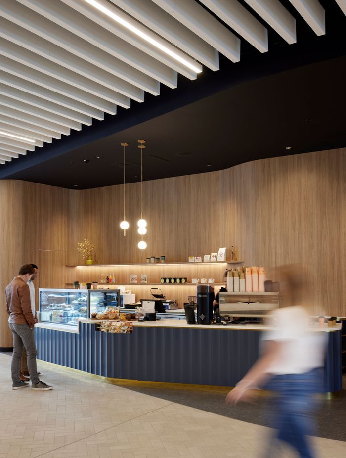 Most tenants in the building do their own fit outs. The pendant lights in the cafe are by Nightworks Studio.