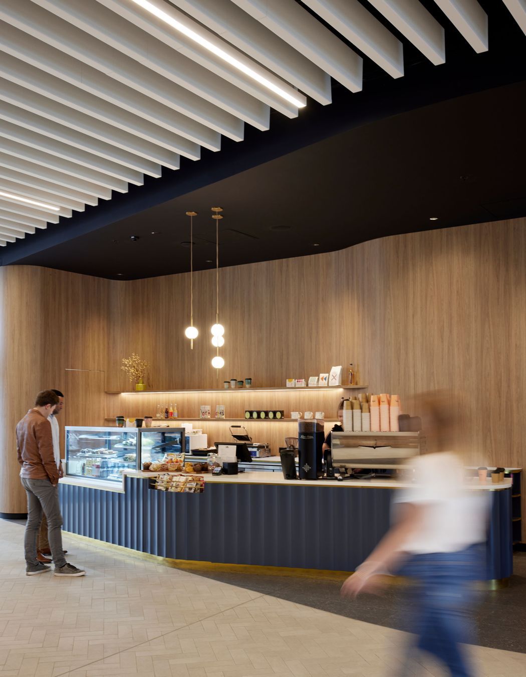 Most tenants in the building do their own fit outs. The pendant lights in the cafe are by Nightworks Studio.
