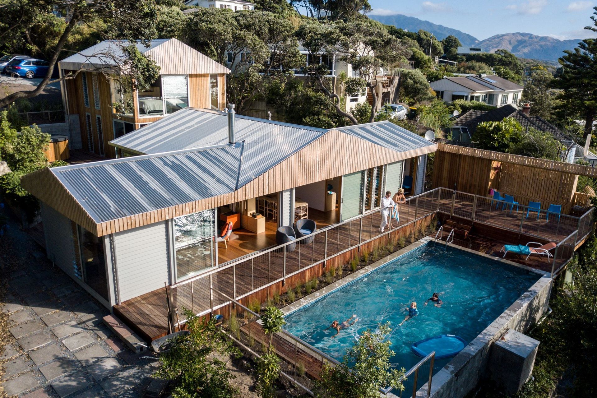 An enviable outdoor living space with a lavish swimming pool and deck. | Photography: Russell Kleyn
