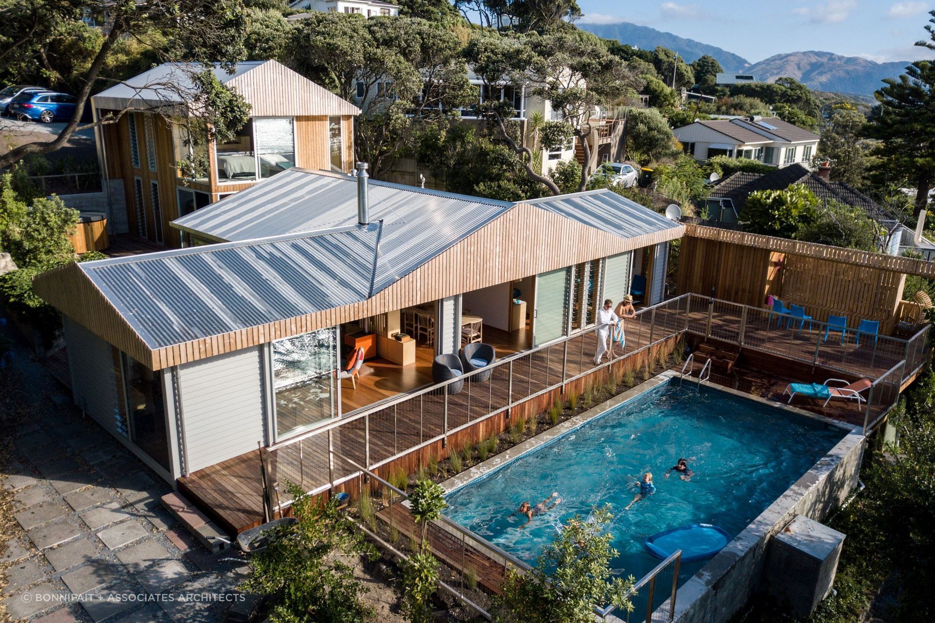 An enviable outdoor living space with a lavish swimming pool and deck. | Photography: Russell Kleyn