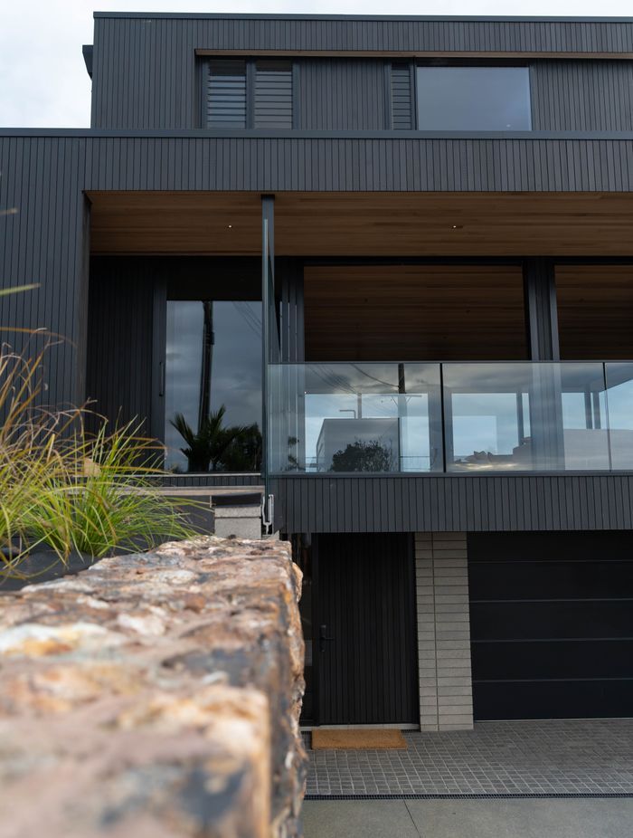The exterior materiality complements the natural surrounds.