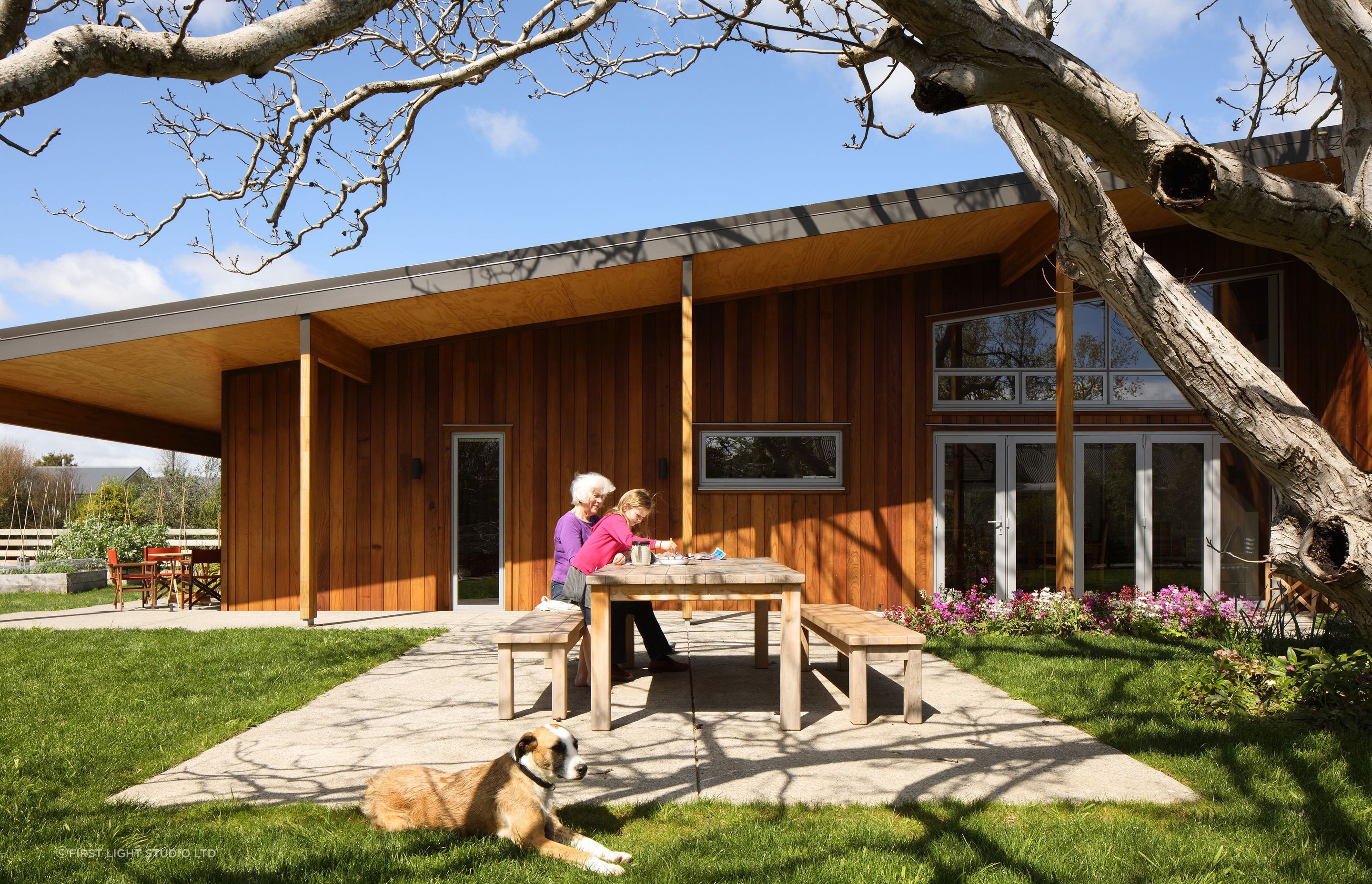 Timber cladding complements the home's beautiful surroundings.