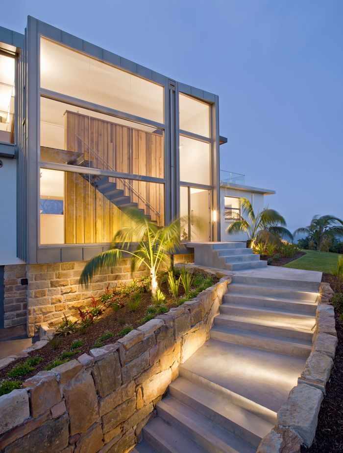 The property features large windows, which help to maximise natural light in the home. Photographer: Simon Wood.
