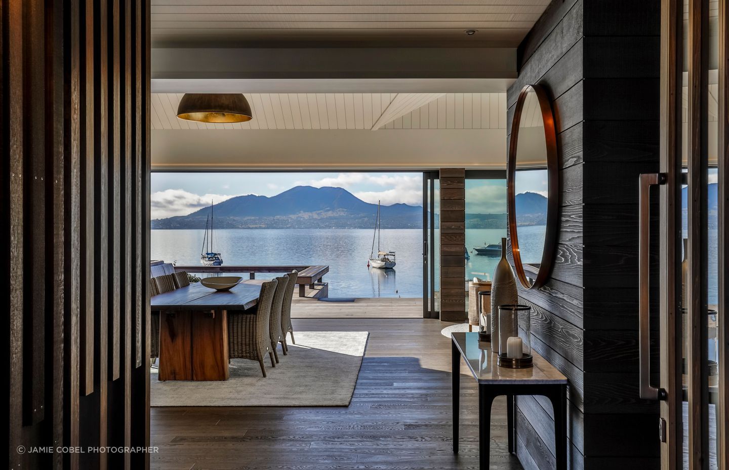 When closed, the beautiful timber front door offers a glimpse of what to expect. When opened, the view is revealed.