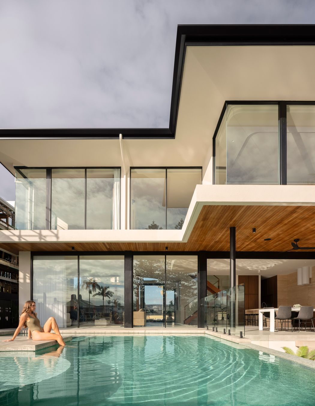 Step straight into the pool from the home's open-plan living space.