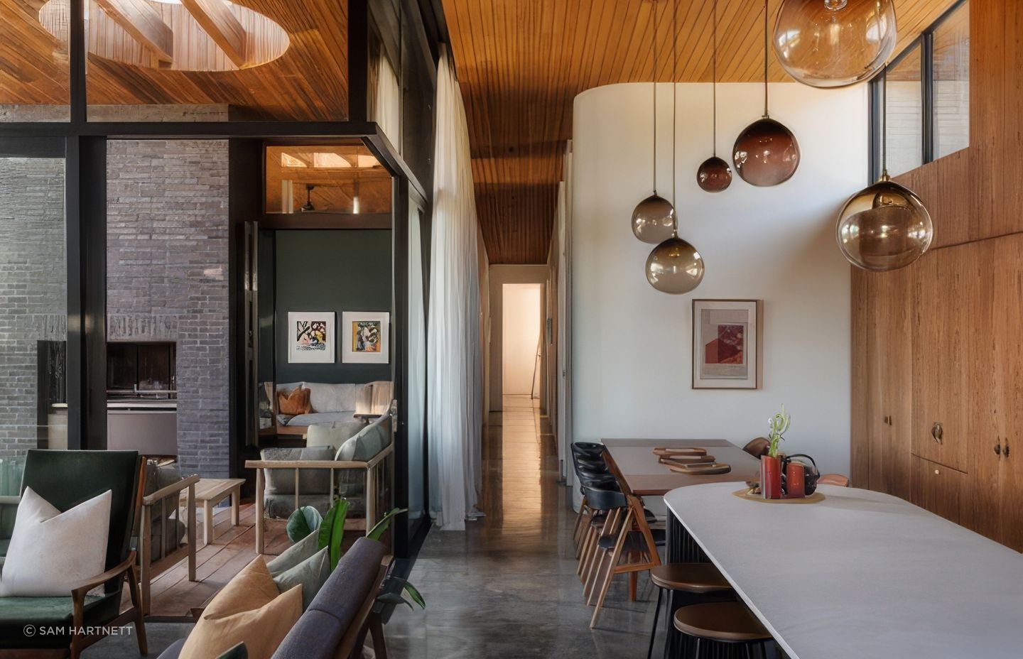 The home is beautifully refined yet equally expressive, revealing its character through curved details and textured materials.