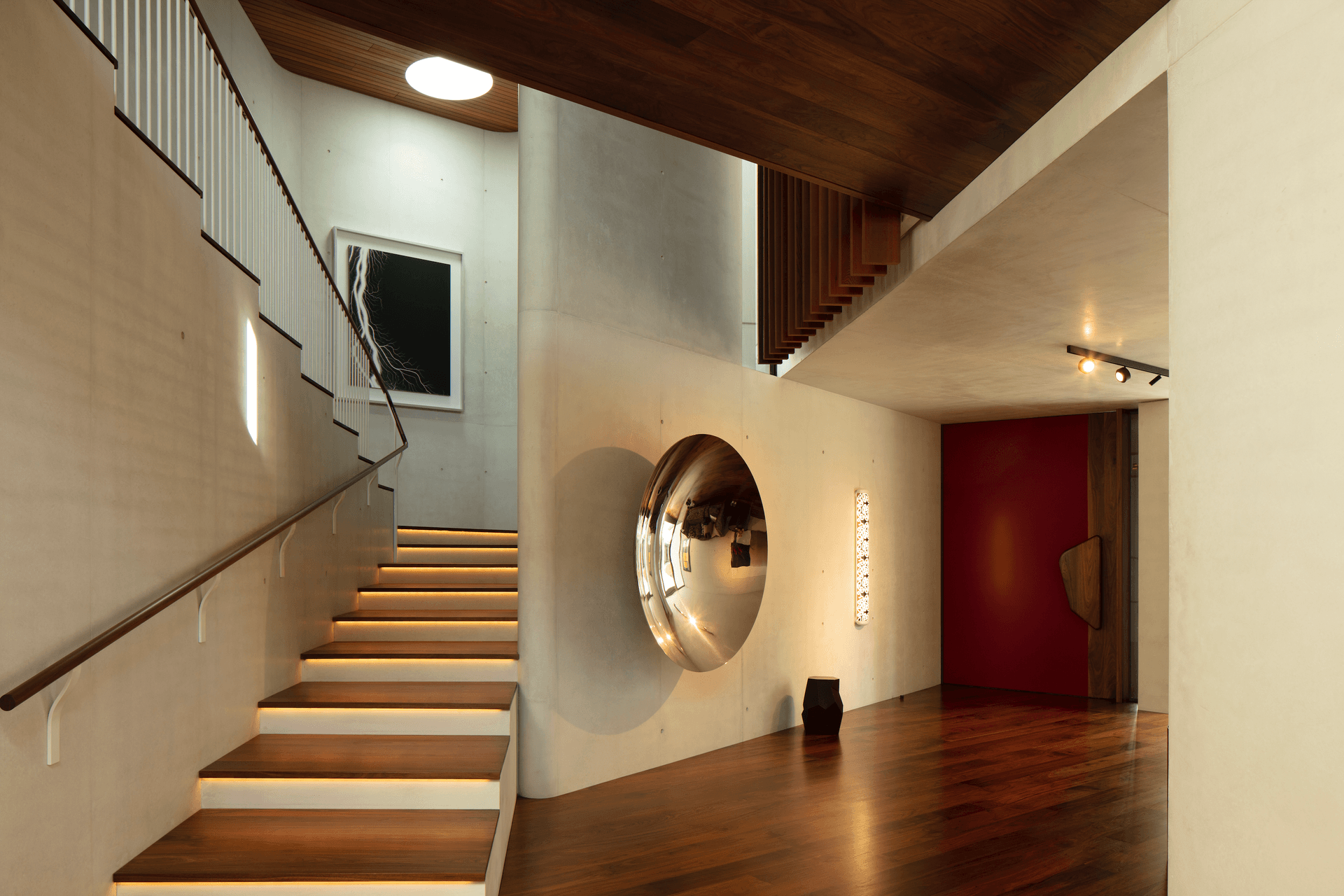 A piece of art in itself, this home also features many artworks by local and international artists – backdropped by the stunning white concrete surfaces.