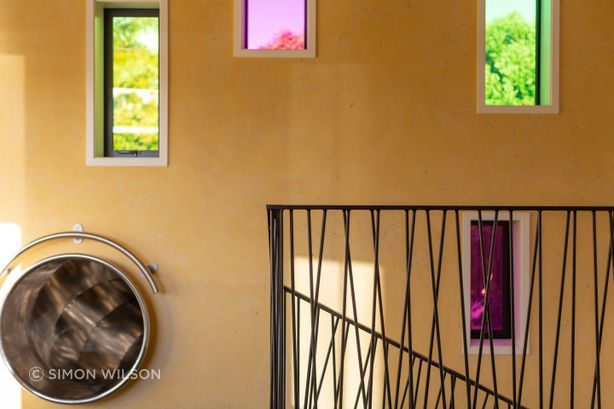 The slide provides an alternative route downstairs, curving out through the wall and snaking down to the ground floor.