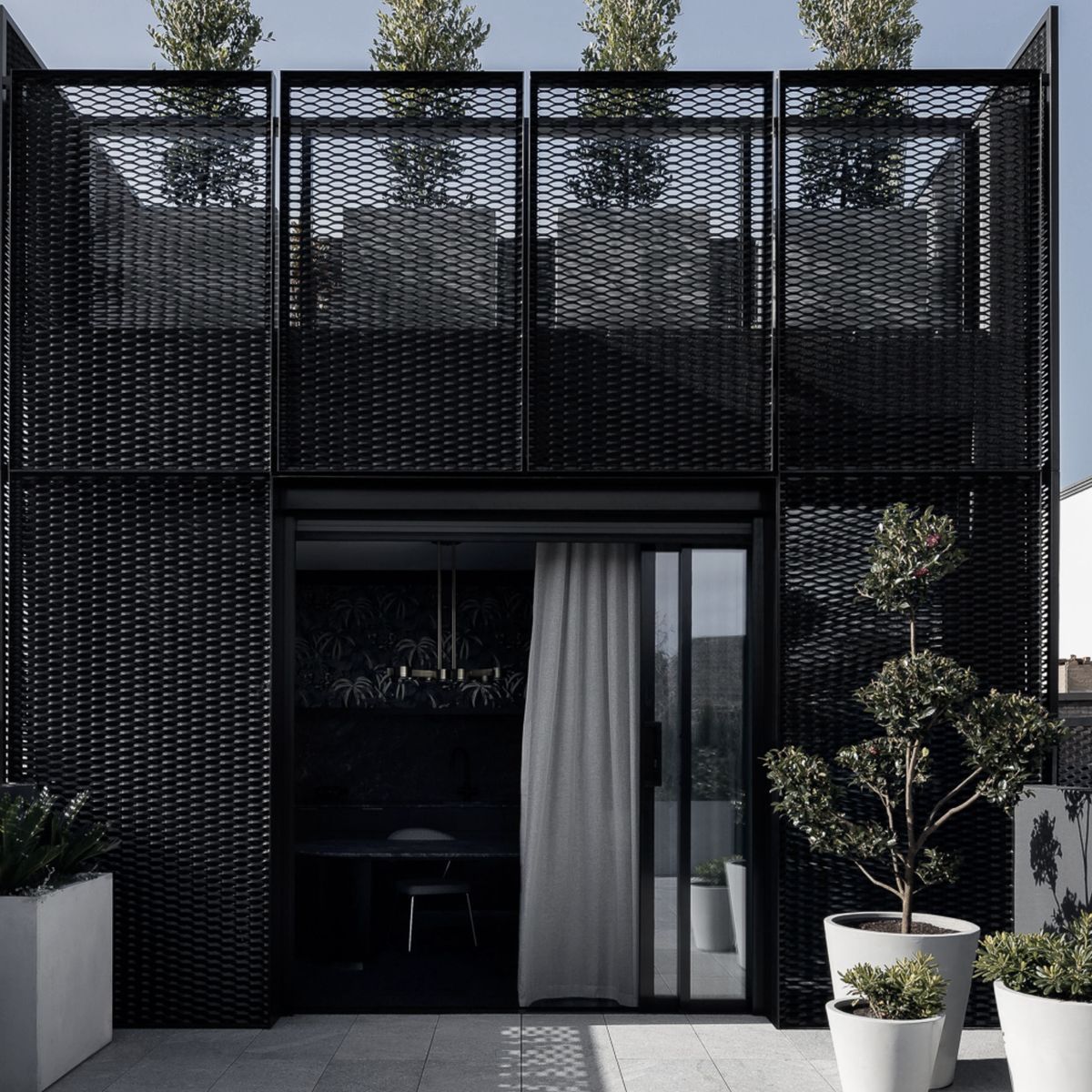 Two architectural typologies converge in this multifunctional office and home in Albert Park