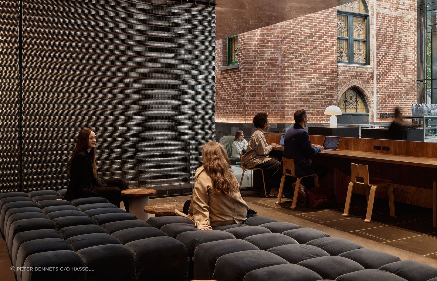 Relaxing on the mezzanine with views to the surrounding historic buildings, here B&B Italia Tufty-Time in soft grey velvet provides a place to catch up with friends and colleagues.